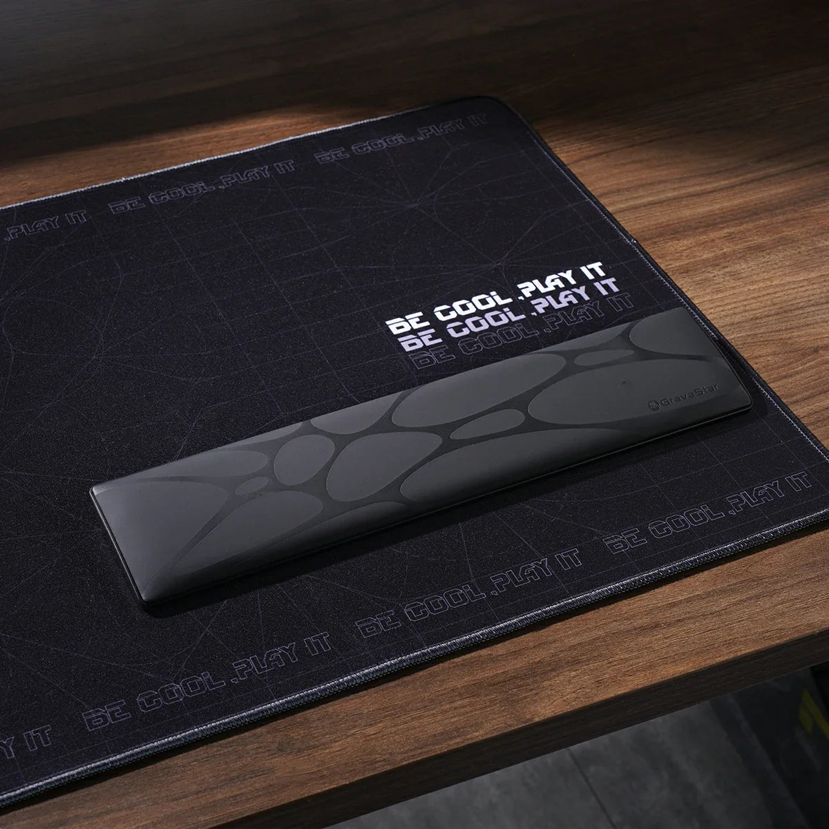 GravaStar 75% Keyboard Wrist Rest Pad Black studio desk setup scene view featuring ergonomic PU leather surface, GravaStar Gaming Mouse Pad black deskmat, non-slip ABS base, and compact wrist alignment support, perfect paired with Mercury V75 Pro Stealth Black keyboard and Mercury M1 Pro Gunmetal Gray gaming mouse.