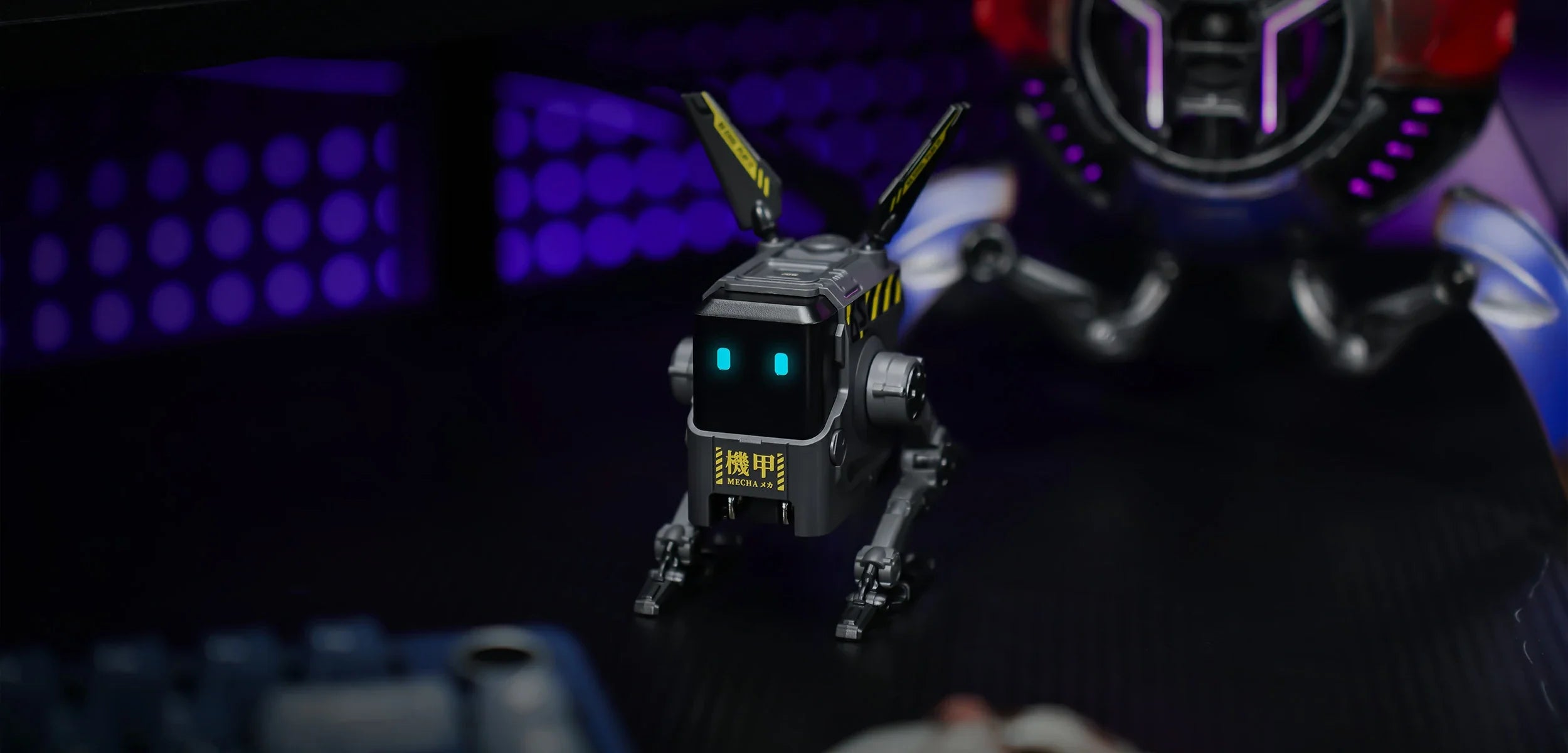 GravaStar Alpha65 GaN 65W Wall Charger Charcoal Gray cyber base panoramic view showing standing matte black mecha robot body, MECHA logo, dual antennas, and ice blue RGB eyes.
