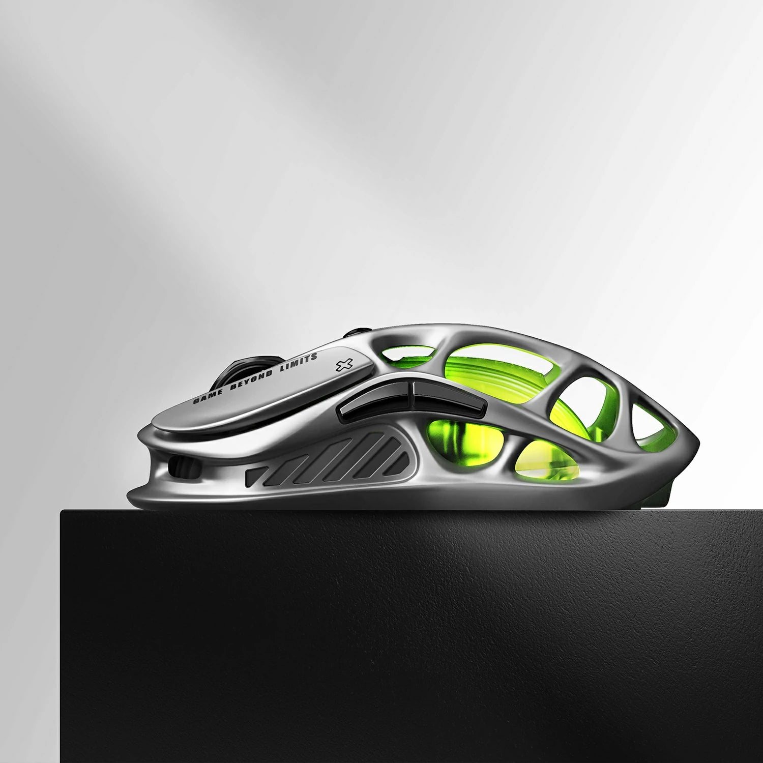 GravaStar Mercury M1 Pro Wireless Gaming Mouse Gunmetal Gray side profile view featuring lightweight magnesium alloy skeletal frame design, PAW3395 26K DPI sensor, GAME BEYOND LIMITS text, and green RGB backlighting.