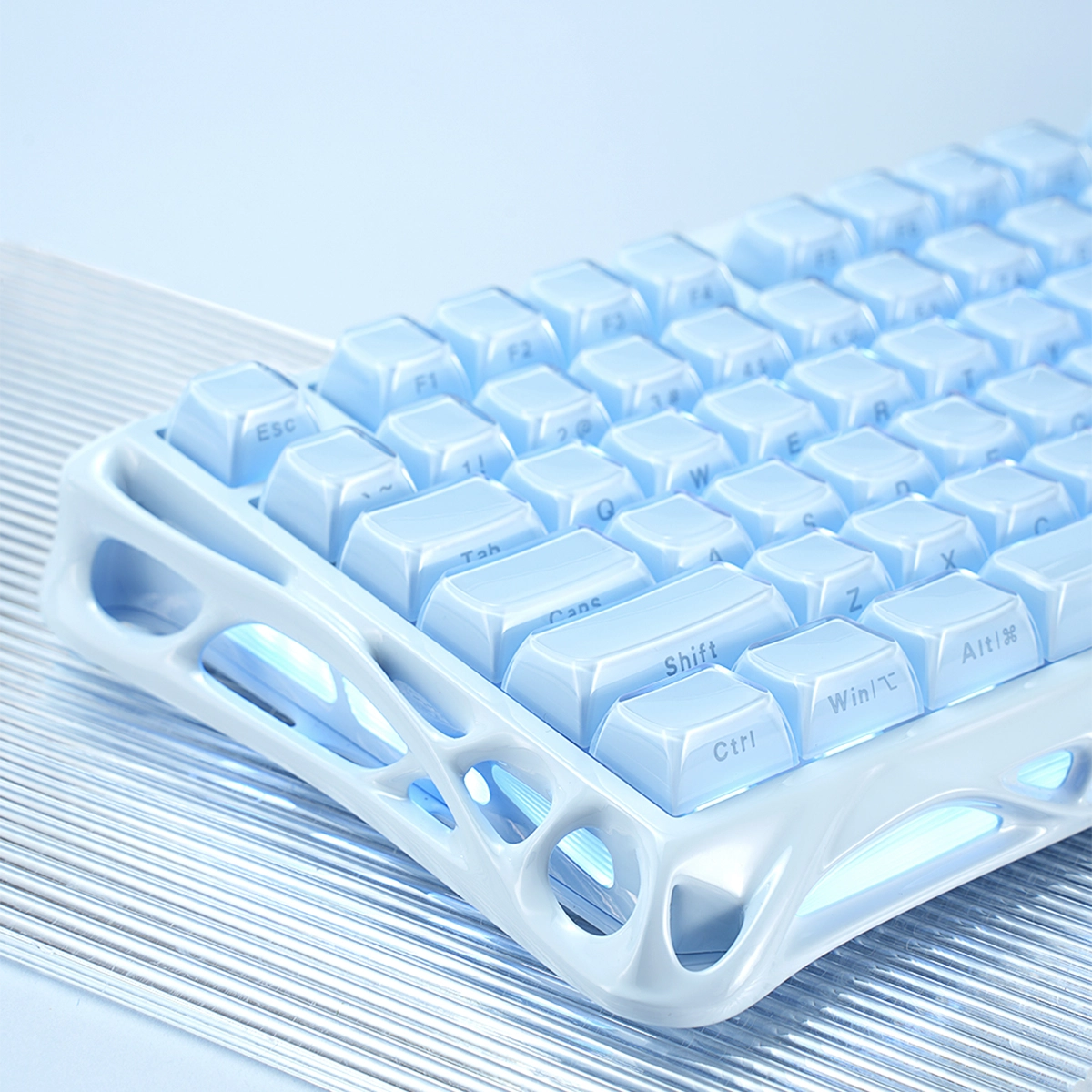 GravaStar Pro Gaming Set Ice Blue Mercury M1 Pro Special Edition wireless gaming mouse top-down view featuring 88g magnesium alloy skeletal frame, PAW3395 26K DPI sensor, and GlowSync RGB backlighting.