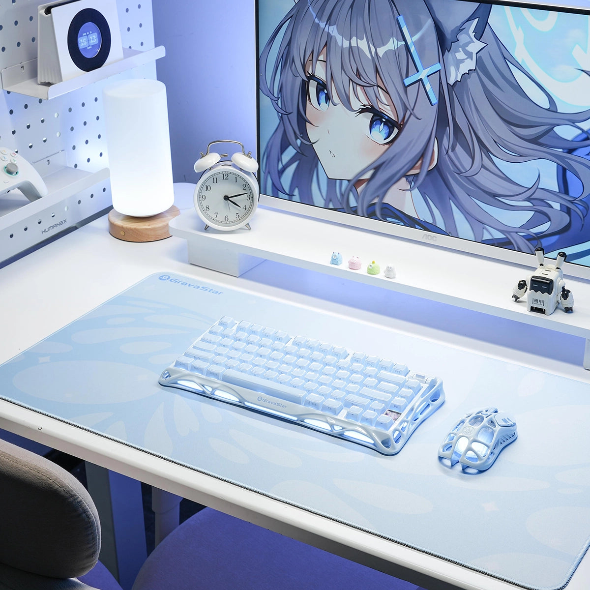 GravaStar Gaming Mouse Pad Blue extended cyberpunk deskmat studio setup view featuring waterproof micro-weave surface, blue fluid bubble grid pattern, Mercury K1 Ice Blue keyboard, and Mercury M1 Pro Ice Blue gaming mouse.