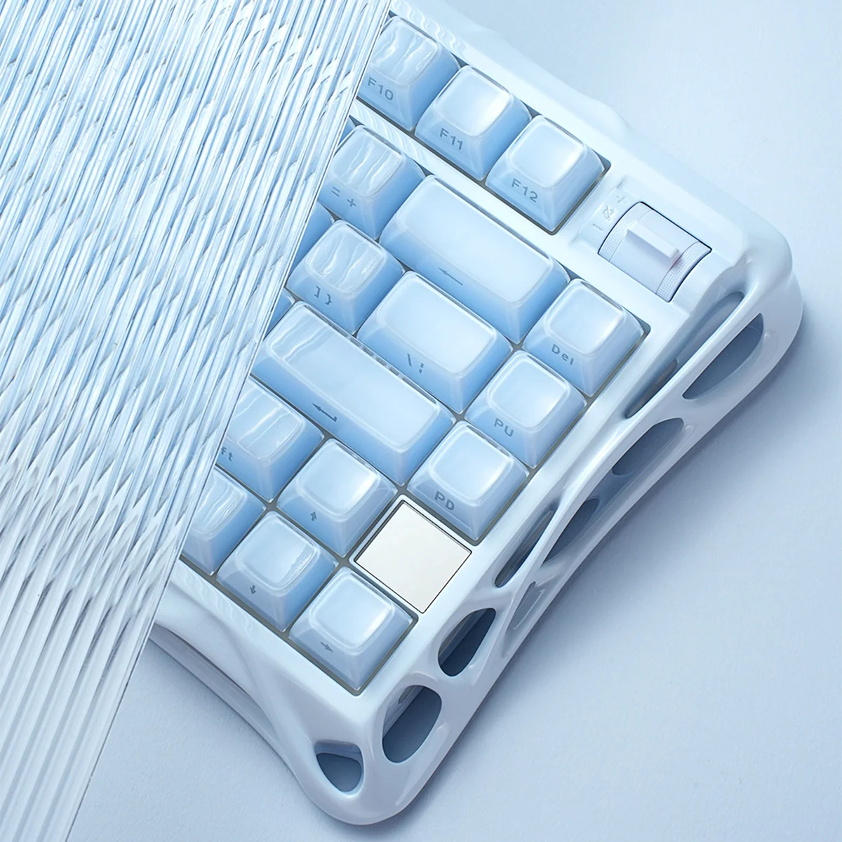 GravaStar Mercury K1 Ice Blue Edition 75% mechanical gaming keyboard macro detail – Showcasing the solid metal volume control knob, ice blue aluminum skeleton frame, and translucent PBT keycaps.