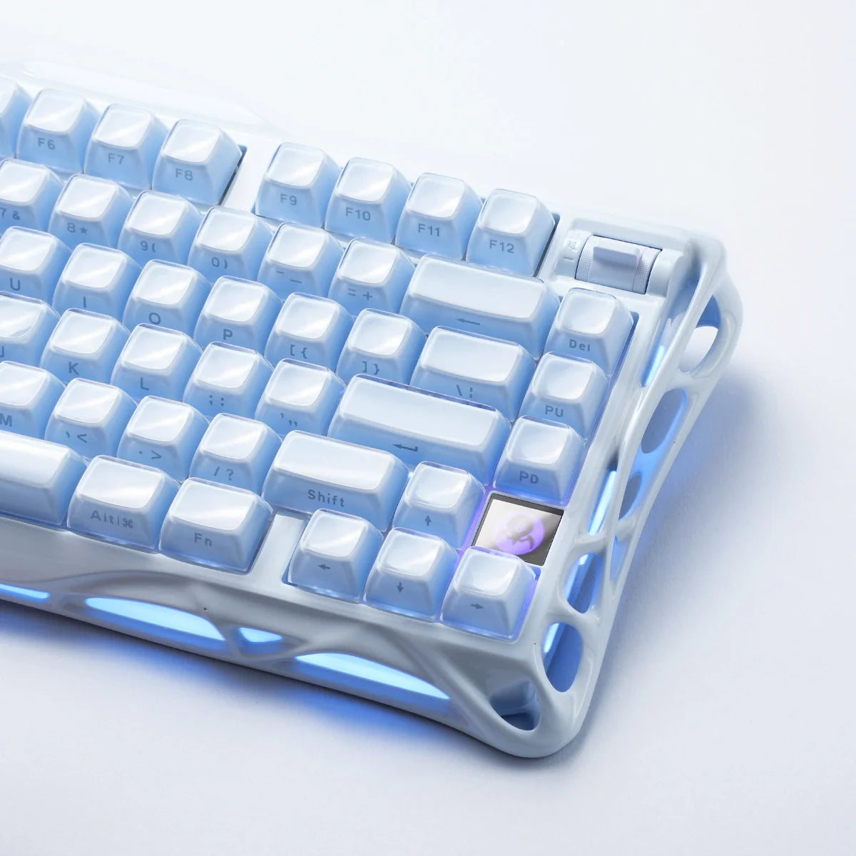 GravaStar Mercury K1 Ice Blue Edition 75% mechanical gaming keyboard macro view – Highlighting matte ice blue aluminum skeleton chassis, translucent ice-blue keycaps, custom linear switches, and dynamic RGB backlighting.