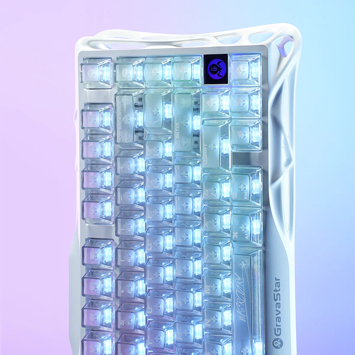 GravaStar Mercury K1 Lite Crystal Aurora Edition 75% mechanical gaming keyboard macro view – Showcasing crystal-clear PC transparent housing with GravaStar branding, purple and blue translucent keycaps, and dynamic RGB backlighting.