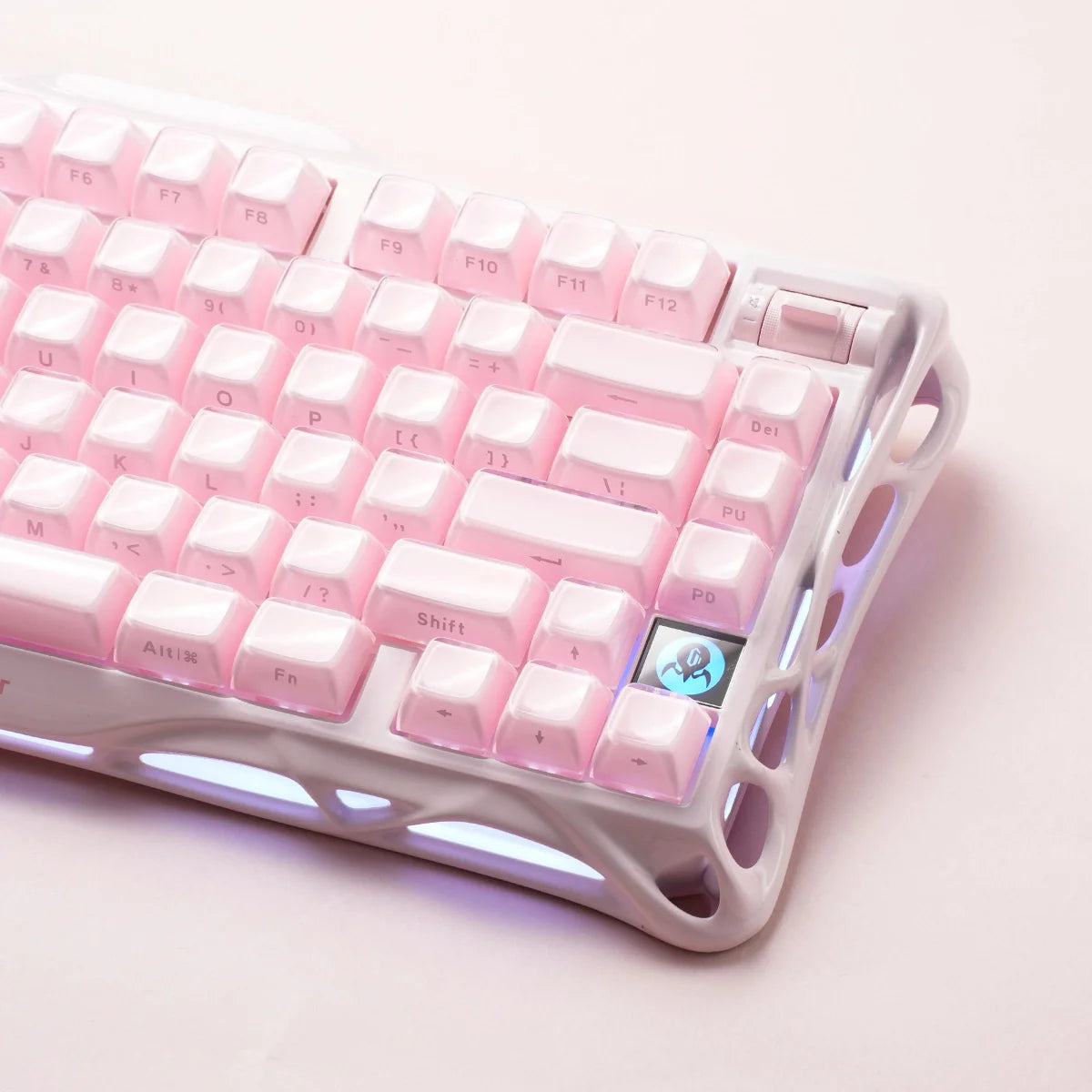 GravaStar Mercury K1 Special Edition Sakura Pink – Close-up of 75% mechanical gaming keyboard showing aluminum alloy exoskeleton frame, custom linear switches, PBT keycaps, and dual-zone RGB backlighting.