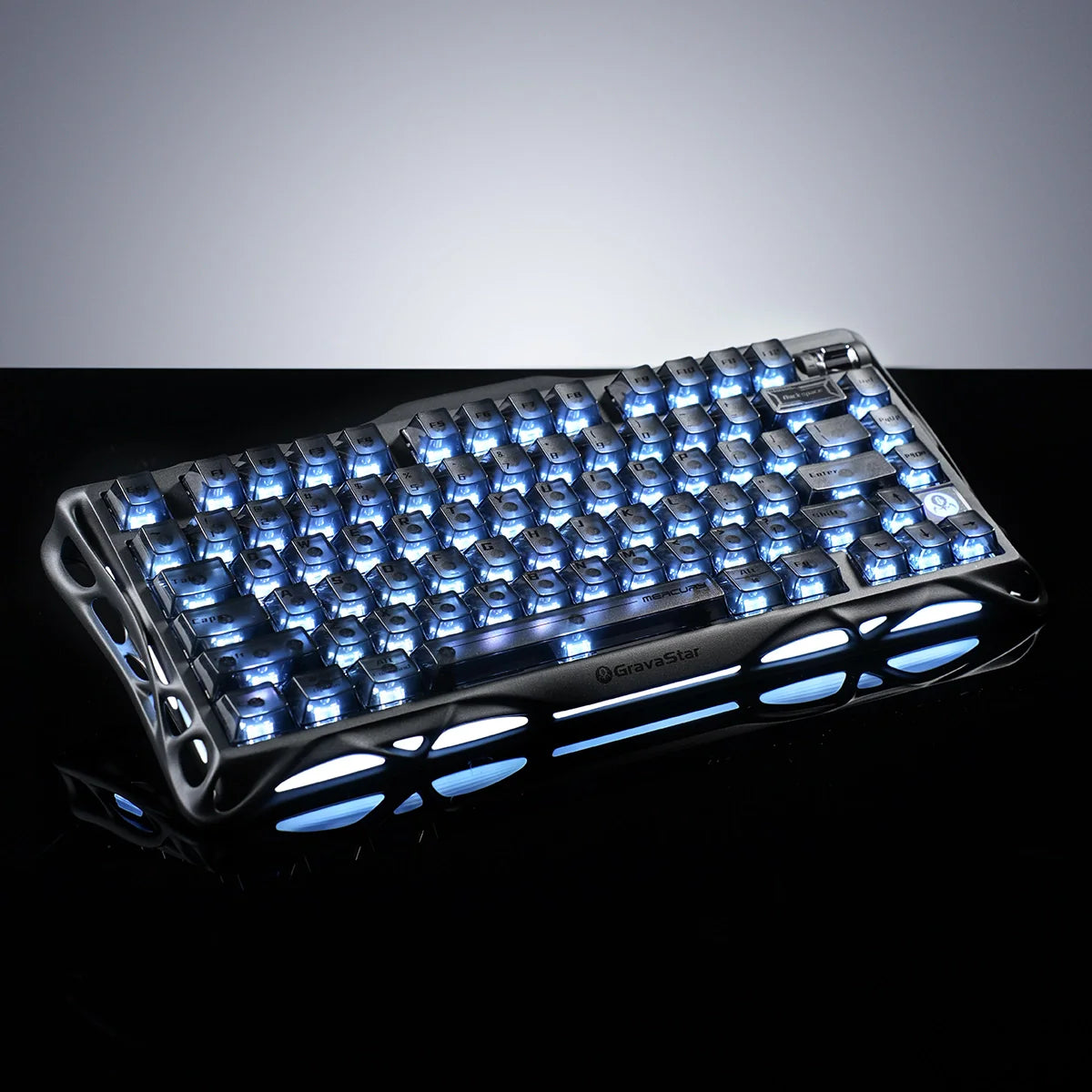 GravaStar Mercury K1 Stealth Black 75% gaming keyboard front macro view – Highlighting matte black aluminum chassis, engraved logo, dual-zone RGB lighting, and custom Stellar Bloom linear switches.
