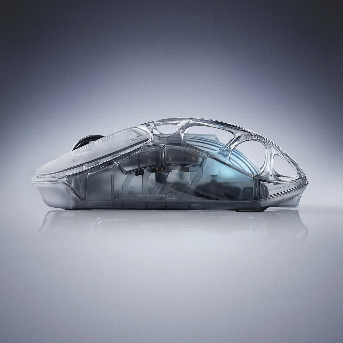 GravaStar Mercury X Air 8KHz Onyx Crystal transparent wireless gaming mouse side view featuring 56g ultralight open-frame skeletal structure, PixArt PAW 3950 32K DPI sensor, 8000Hz polling rate support, and ice blue RGB lighting, perfect paired with Mercury V60 Onyx Crystal keyboard and Mars Pro speaker.