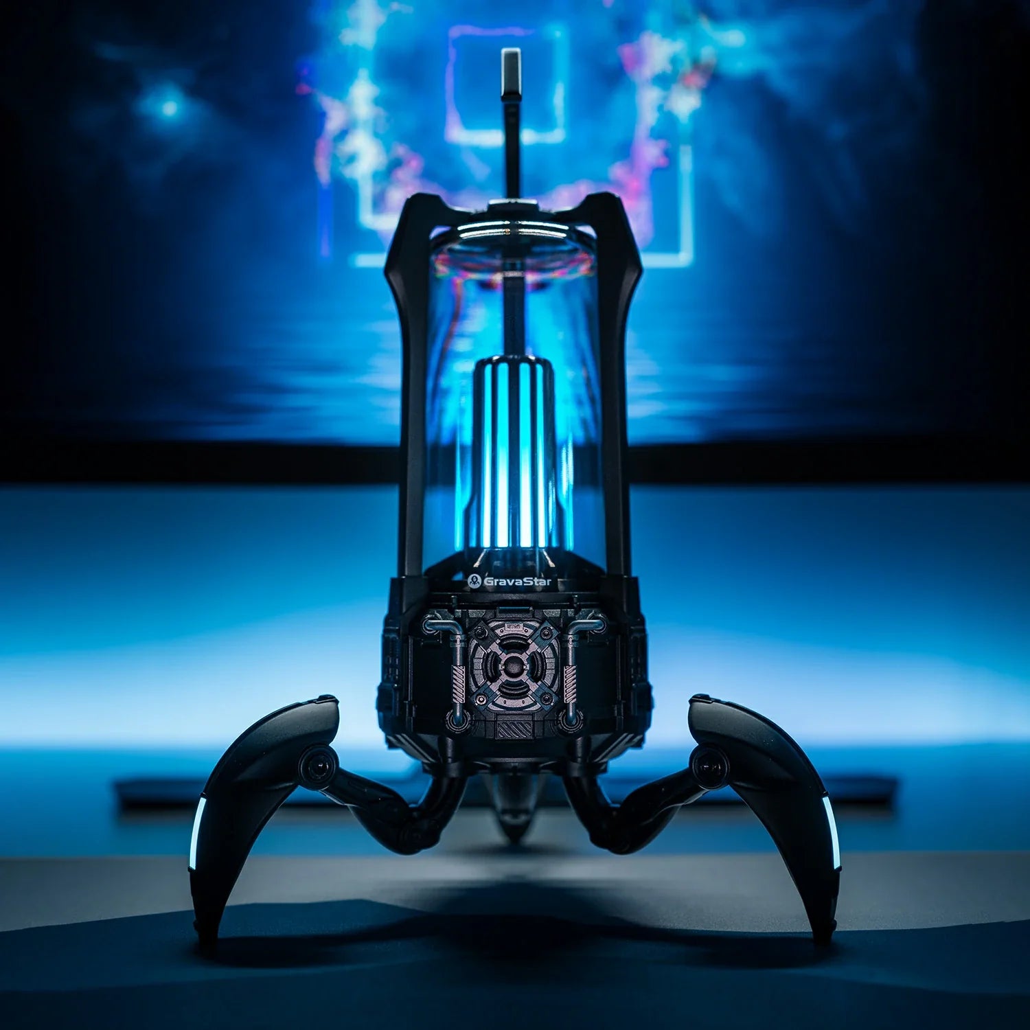 GravaStar Supernova Matt Black mecha-lantern Bluetooth speaker desktop front view featuring 25W dual-driver sound system, 3" woofer, 0.5" tweeter, zinc alloy frame, foldable tripod stand, carry handle, and vibrant RGB lighting, perfect paired with Mercury X Air Onyx Crystal mouse and Mercury V60 keyboard.