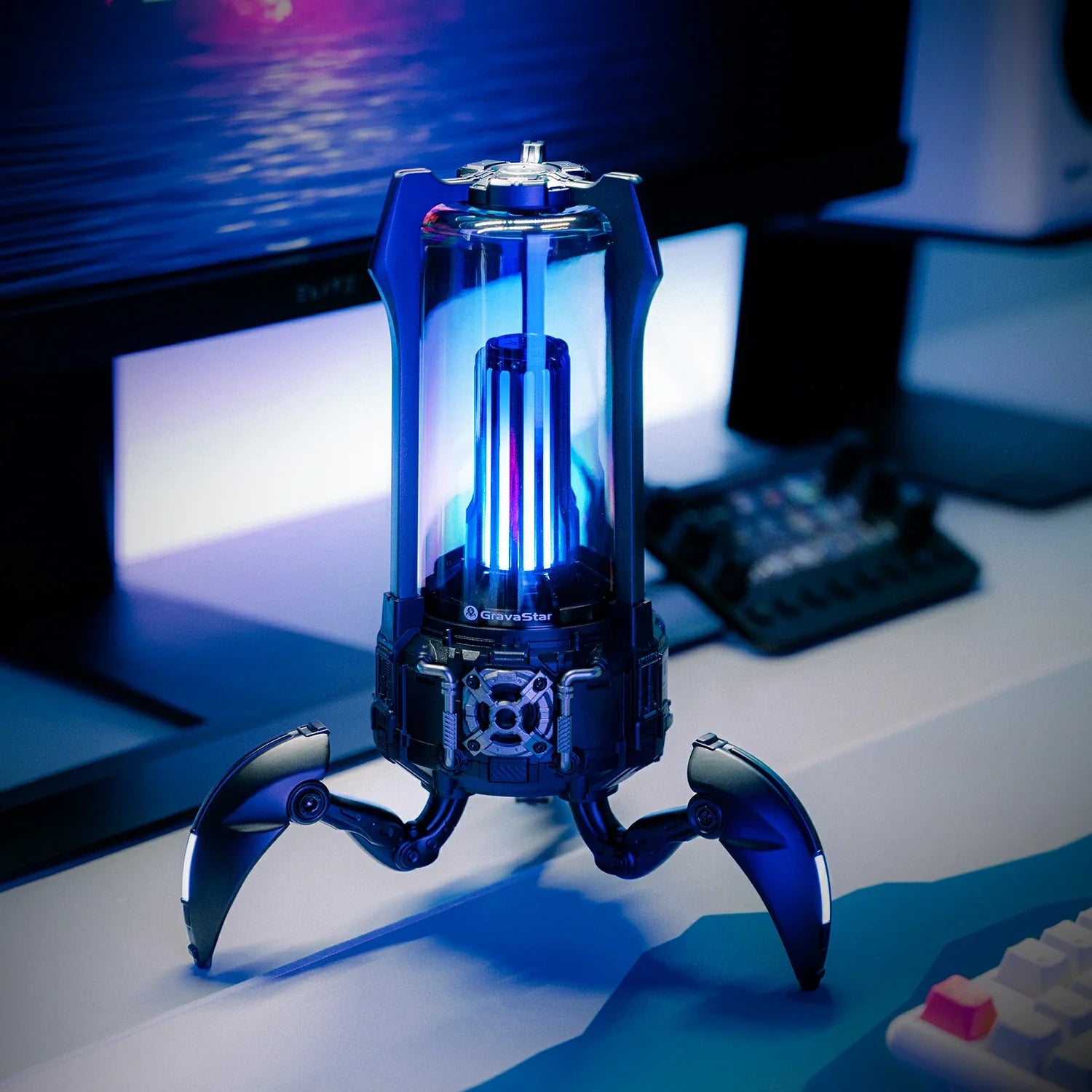 GravaStar Supernova Matt Black mecha-lantern Bluetooth speaker dynamic blue RGB lighting view featuring 25W dual-driver sound system, 3" woofer, 0.5" tweeter, zinc alloy frame, foldable tripod stand, carry handle, and 3x8 LED dynamic lighting modes, perfect paired with Mercury X Air Onyx Crystal mouse and Mercury V60 keyboard.