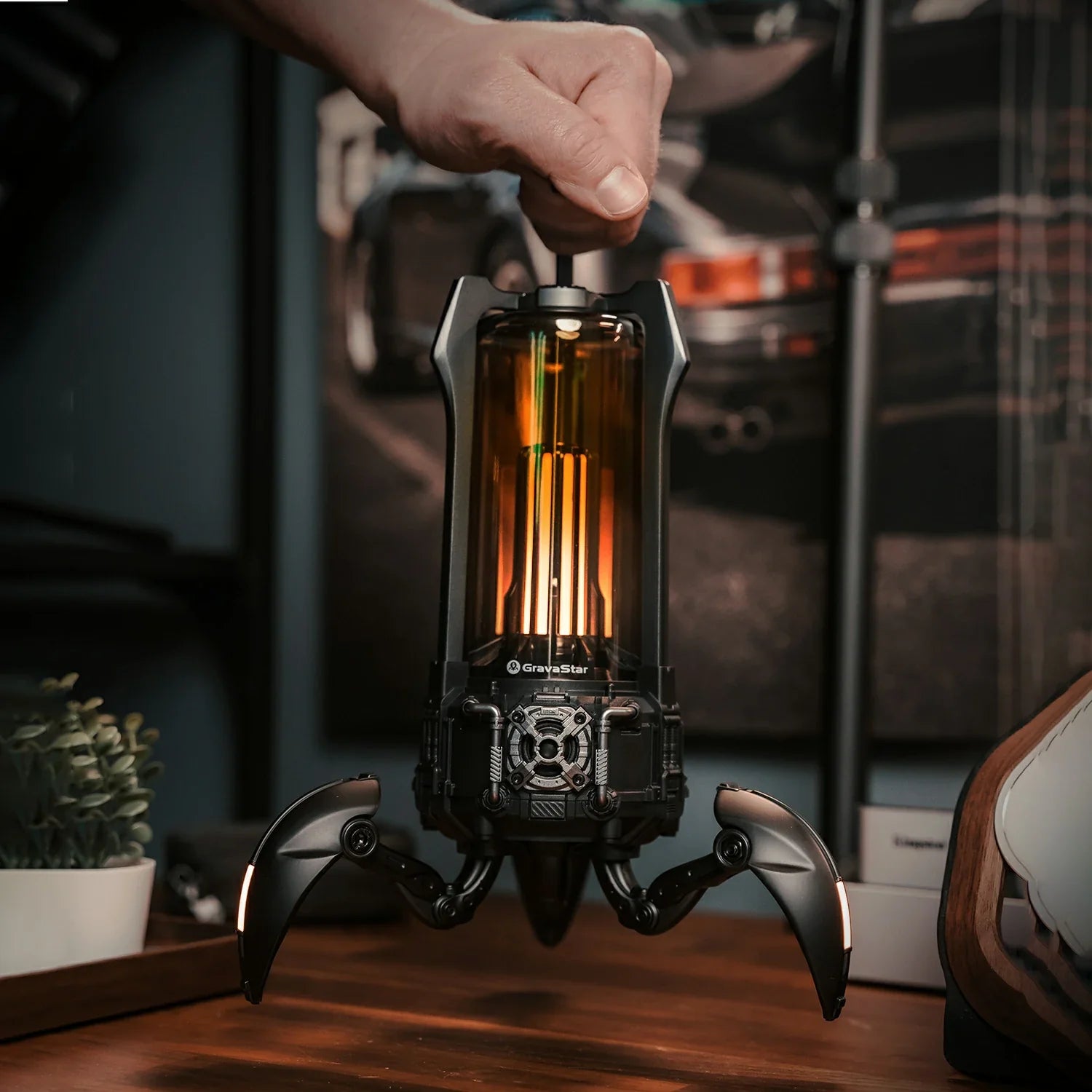 GravaStar Supernova Matt Black mecha-lantern Bluetooth speaker portable carry handle camping view featuring 25W dual-driver sound system, 3" woofer, 0.5" tweeter, zinc alloy frame, foldable tripod stand, removable handle, and camping firelight mode, perfect paired with Mercury X Air Onyx Crystal mouse and Mercury V60 keyboard.