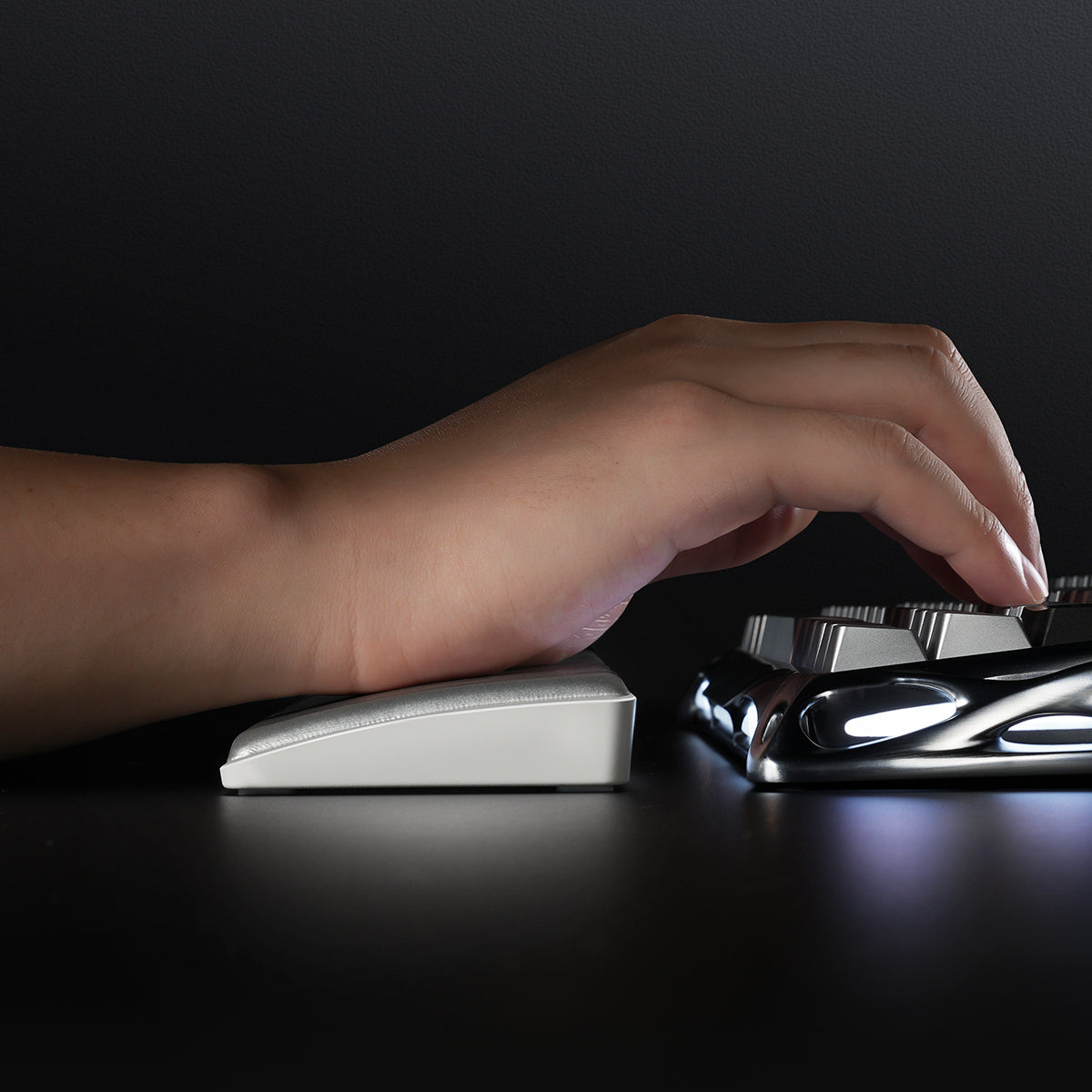 GravaStar 60% Keyboard Wrist Rest Pad Silver side profile close-up view showing ergonomic wrist support in use with Mercury V60 Pro gaming keyboard to reduce wrist fatigue.