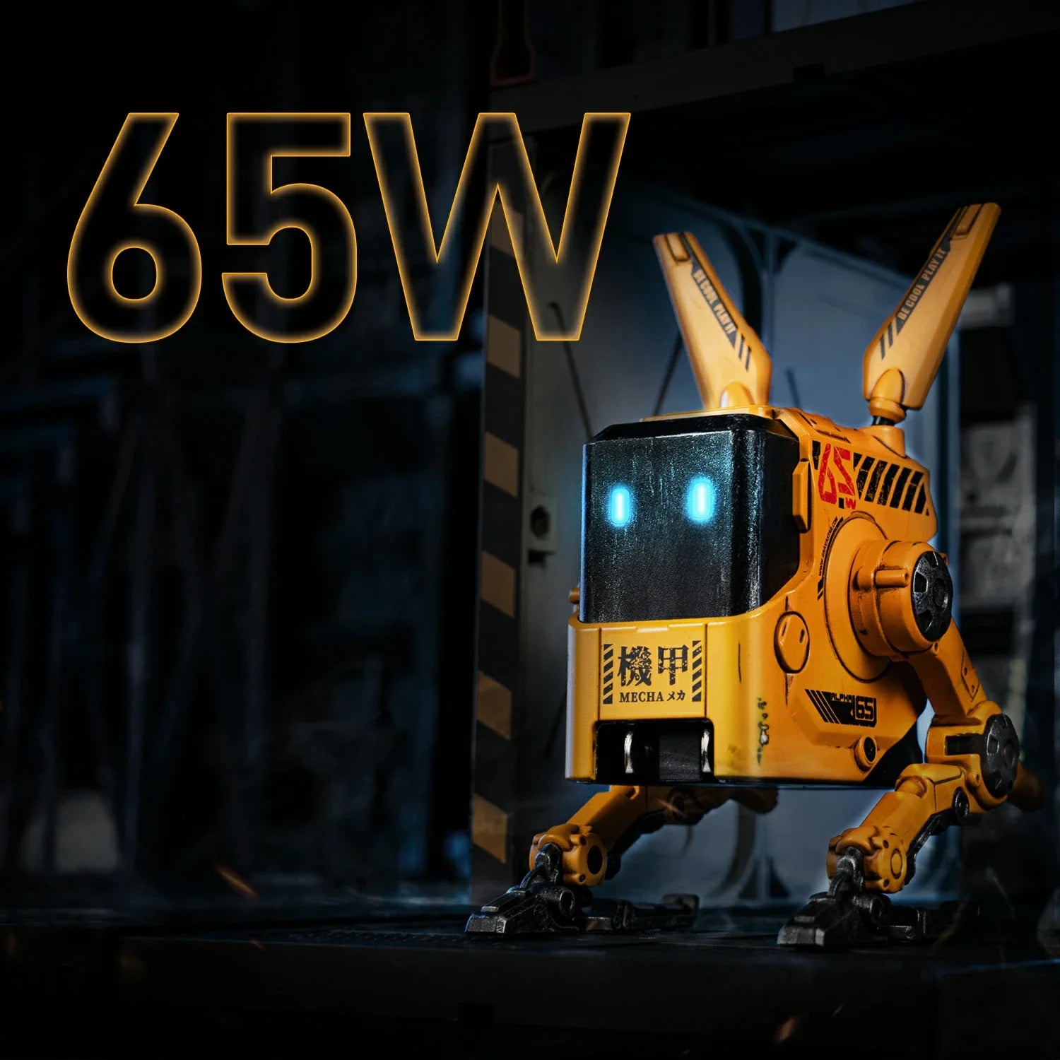 GravaStar Alpha65 GaN 65W Wall Charger War-Damaged Yellow 65W output tactical mecha view showing handcrafted weathered yellow body, MECHA logo, transformable tripod stand, dual antennas, and ice blue RGB eyes.