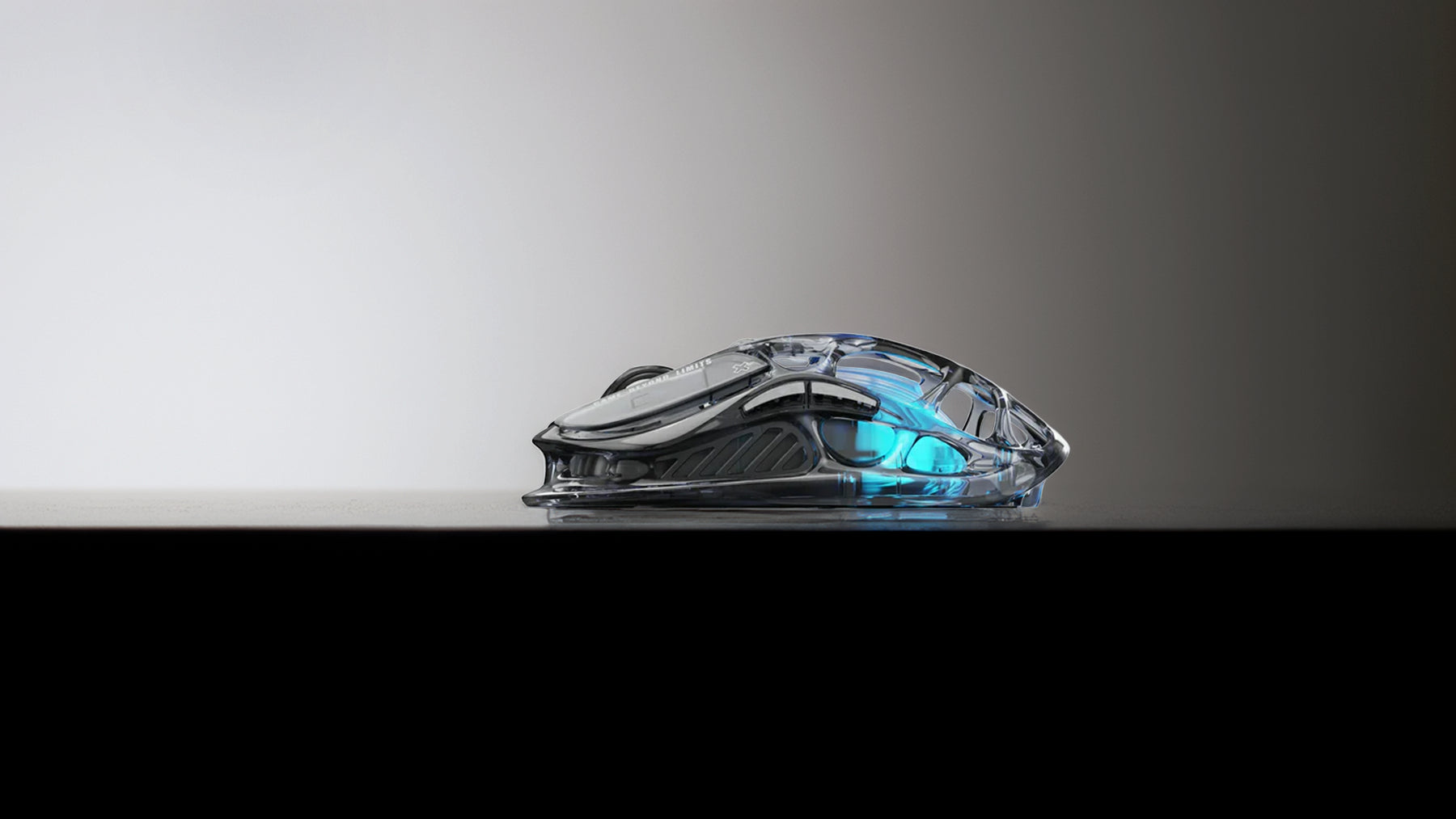 GravaStar Core Flex Gaming Set Transparent Black Mercury M2 gaming mouse profile side view featuring transparent PC mecha housing, 79g hollow chassis, and GLOWSYNC blue lighting.