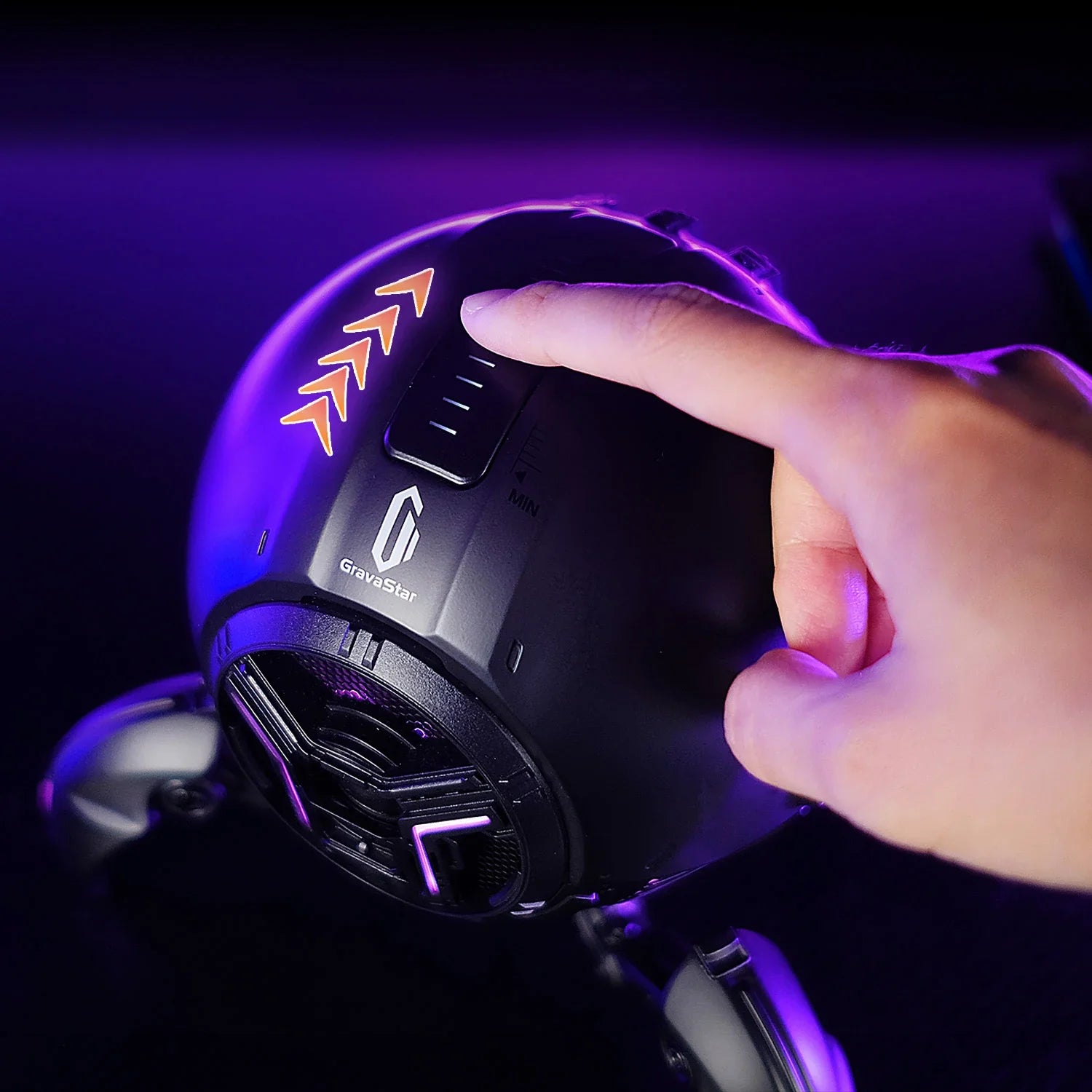 GravaStar Mars Pro Black Bluetooth speaker close-up demonstrating top touch-sensitive panel for volume adjustment with glowing LED indicators, powered by matte black zinc alloy shell, 20-watt dual speaker system, and purple RGB lighting.