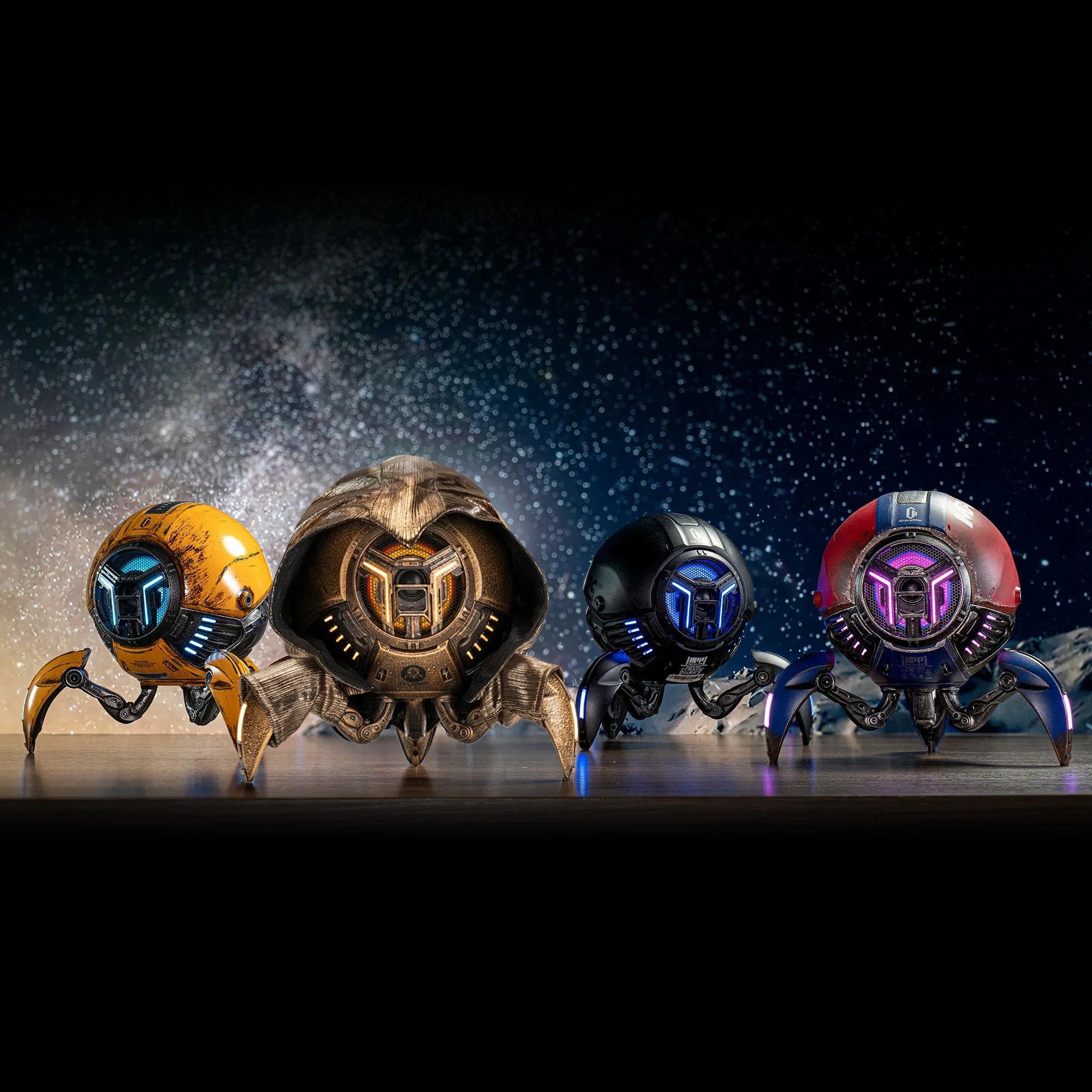 GravaStar Mars Pro series Bluetooth speakers lineup banner showcasing Matte Black, War-Damaged Yellow, Special Edition, and White colorways, each featuring zinc alloy shell, shock-absorbing tripod legs, 20-watt dual speaker system, passive bass radiator, and dynamic RGB lighting.
