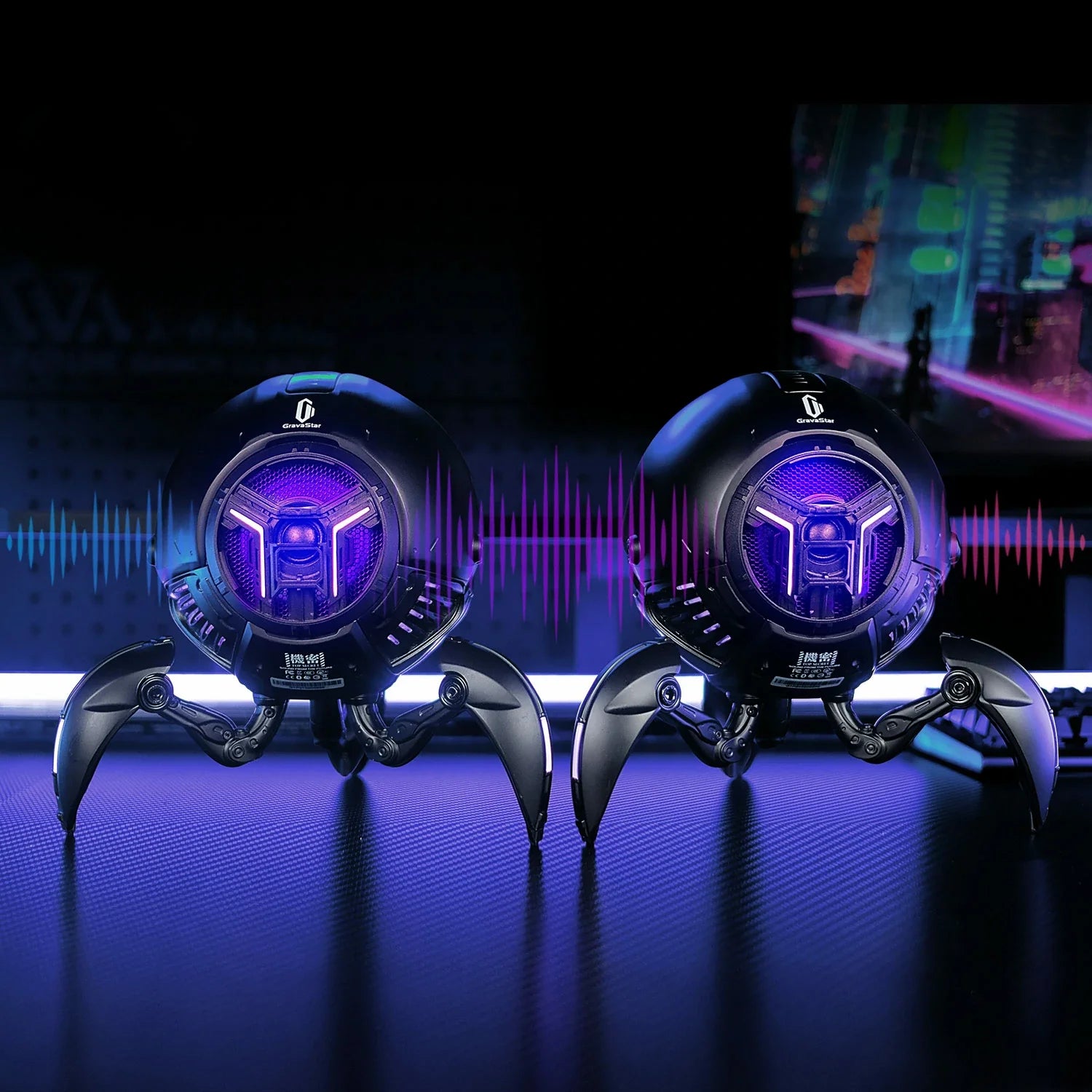 Two GravaStar Mars Pro Black Bluetooth speakers paired in True Wireless Stereo (TWS) mode featuring Bluetooth 5.0 connection, matte black zinc alloy shells, shock-absorbing tripod legs, 20-watt dual speaker system with passive bass radiator, and purple RGB lighting.