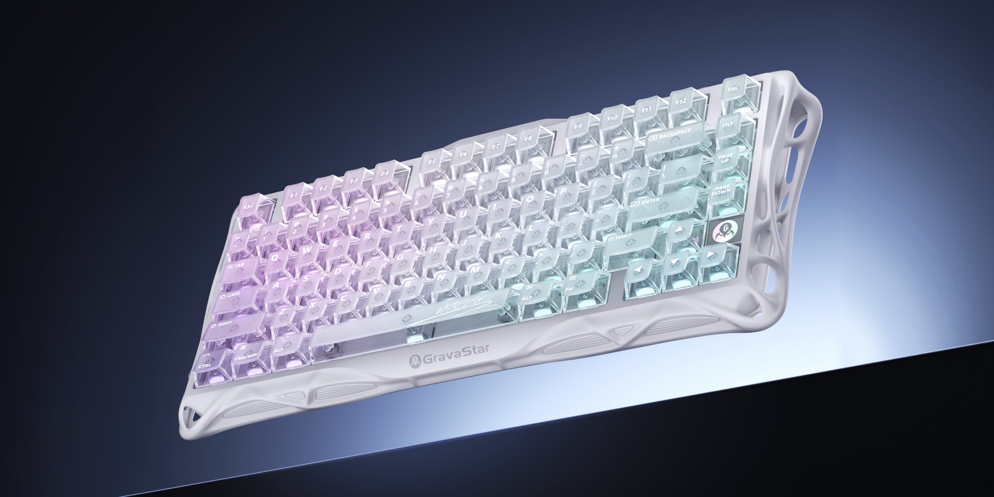 GravaStar Mercury K1 Lite Crystal Aurora 75% wireless mechanical gaming keyboard front angled view showing transparent PC crystal housing, GravaStar logo, purple translucent keycaps, and RGB backlighting.