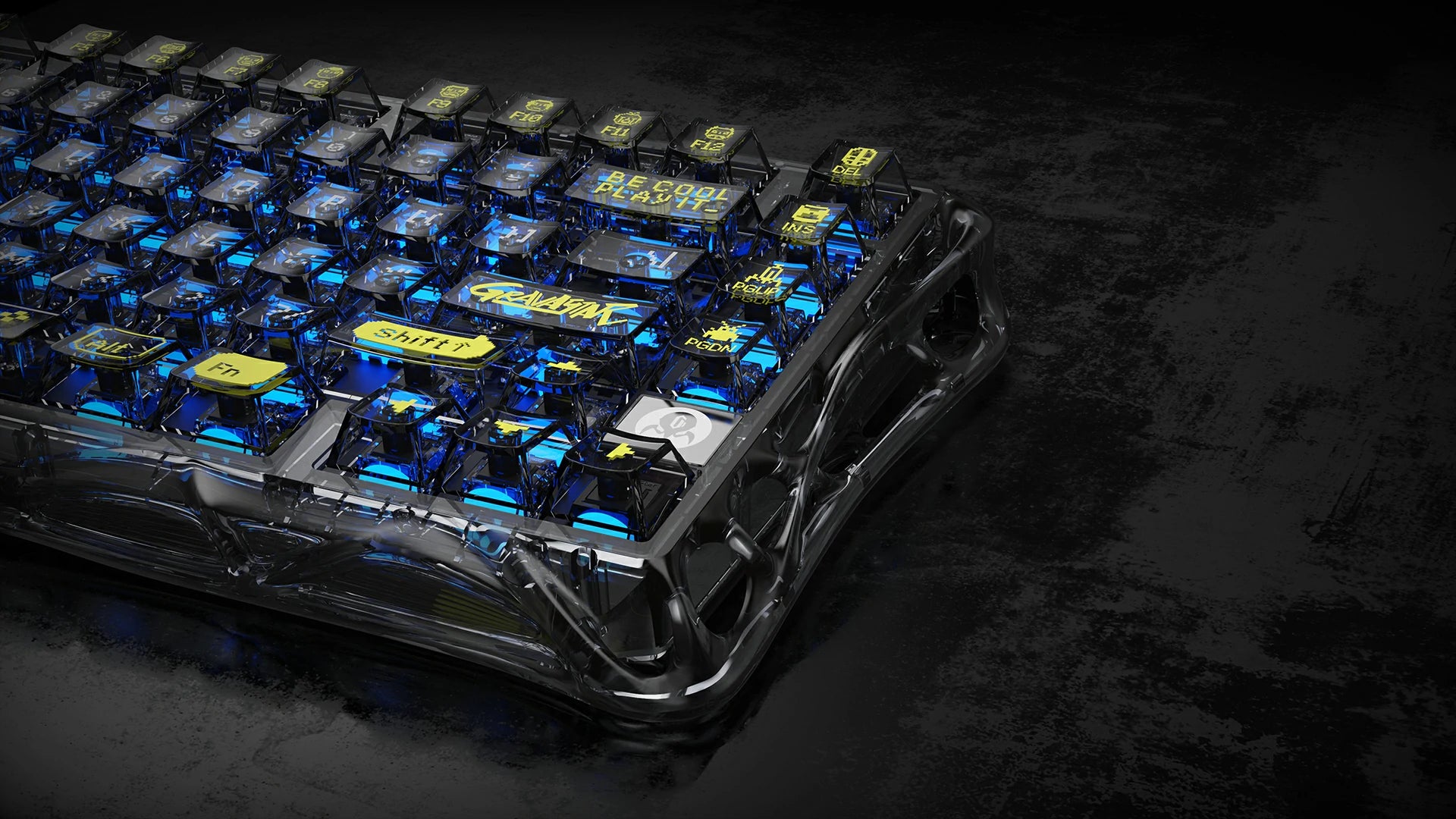 GravaStar Mercury K1 Lite Transparent Black 75% wireless mechanical gaming keyboard high-angle close-up view showcasing transparent black PC chassis, printed keycaps, GravaStar logo, and blue RGB backlighting.