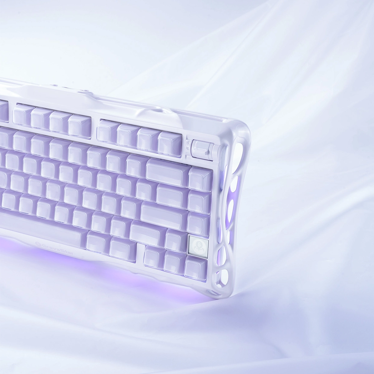 GravaStar Mercury K1 Special Edition Lavender Purple 75% mechanical gaming keyboard close-up showing hollowed aluminum alloy exoskeleton chassis, Gasket mount structure, custom PBT keycaps, and dual ARGB lighting effects.