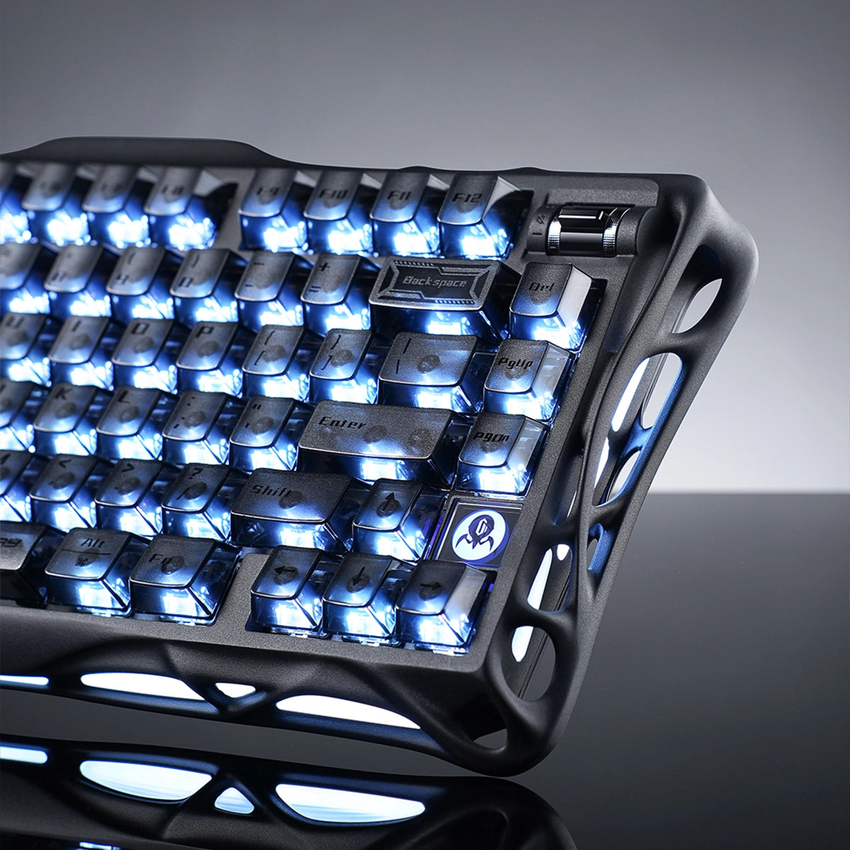 GravaStar Mercury K1 Stealth Black 75% wireless mechanical gaming keyboard close-up highlighting tactile metallic rotary knob, translucent PBT keycaps, hollowed matte black aluminum alloy chassis, and dual RGB backlighting.