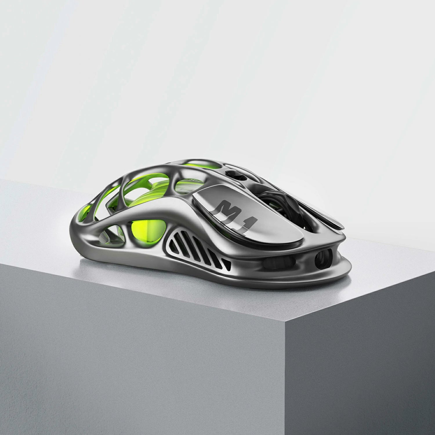 GravaStar Mercury M1 Pro Wireless Gaming Mouse Gunmetal Gray right side profile view featuring magnesium alloy skeletal frame, M1 logo on right button, PAW3395 26K DPI sensor, and green RGB backlighting.