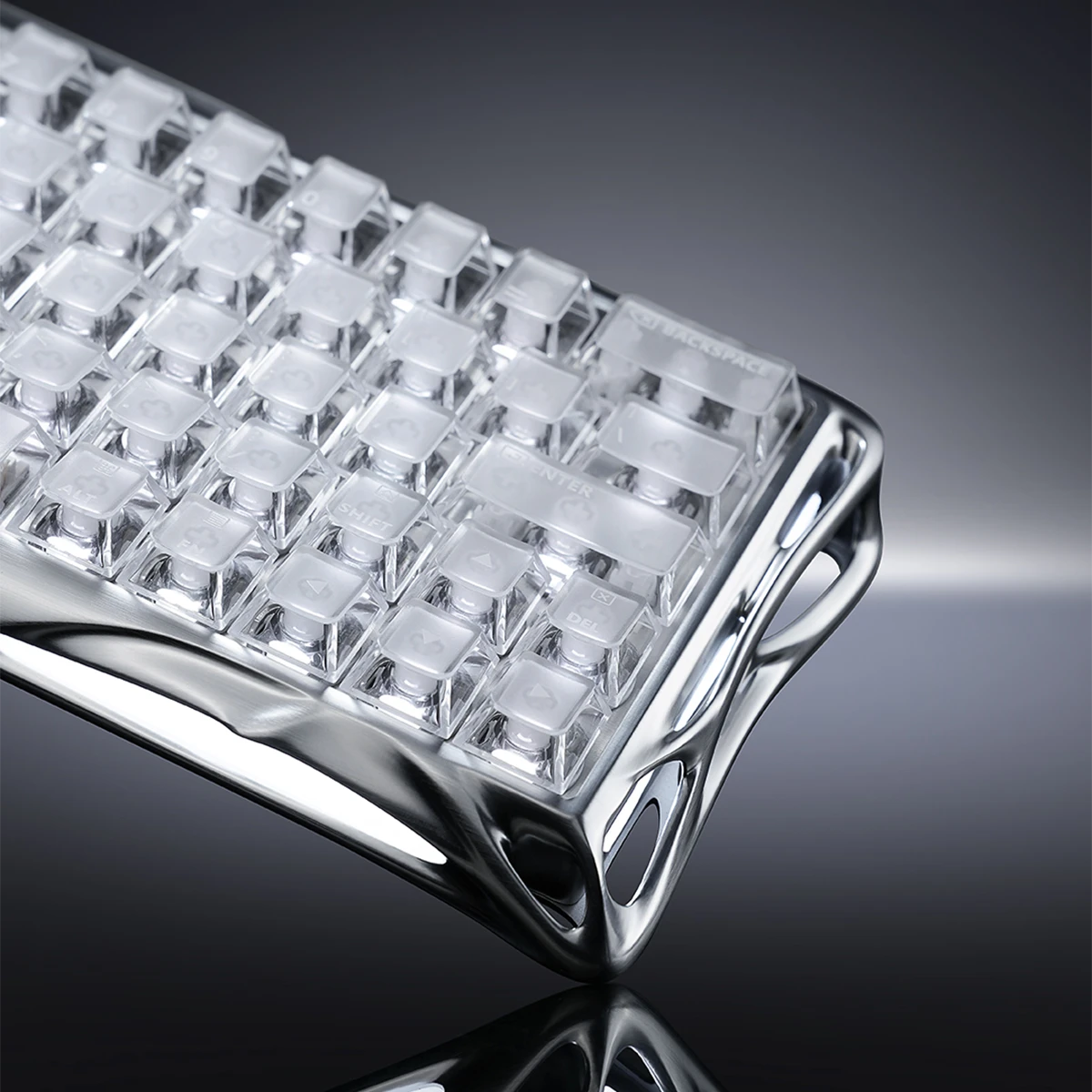 GravaStar Mercury V60 Pro Deluxe Edition Chrome Silver 60% compact aluminum gaming keyboard macro view featuring full frosted transparent PC keycaps, white UFO magnetic switches, True 8kHz polling rate, 0.125ms low latency, and dual-zone RGB backlighting.