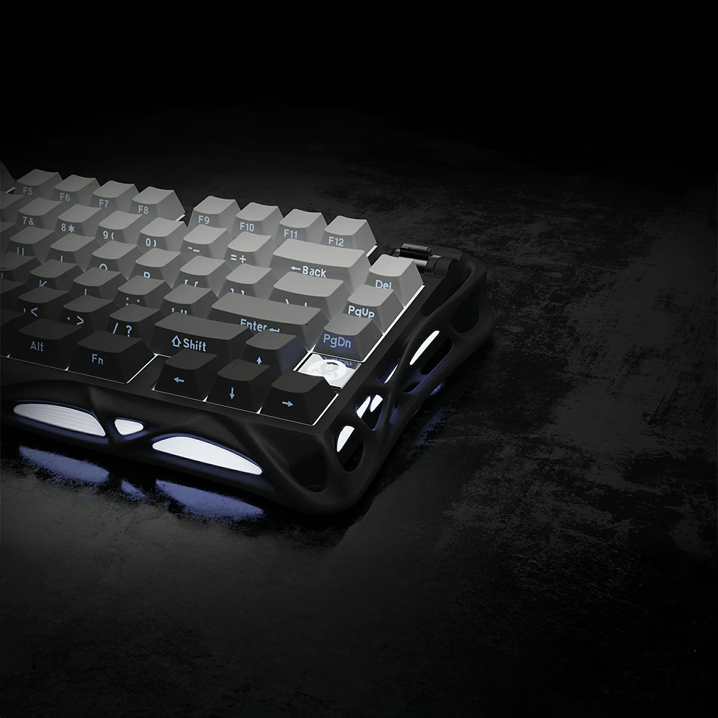 GravaStar Pro Gaming Set Gradient Black Mercury K1 75% wireless mechanical gaming keyboard rear side view featuring gradient black aluminum skeletal frame, gradient shine-through keycaps, and blue RGB backlight.