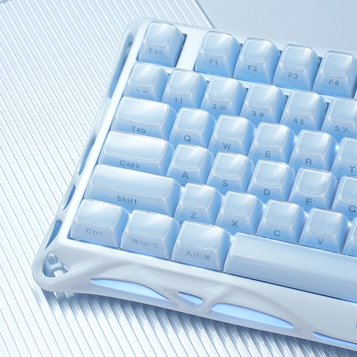 GravaStar Pro Gaming Set Ice Blue Mercury K1 Special Edition keyboard skeletal frame view showing metallic blue aluminum chassis, hot-swappable switches, and 8000mAh battery construction.