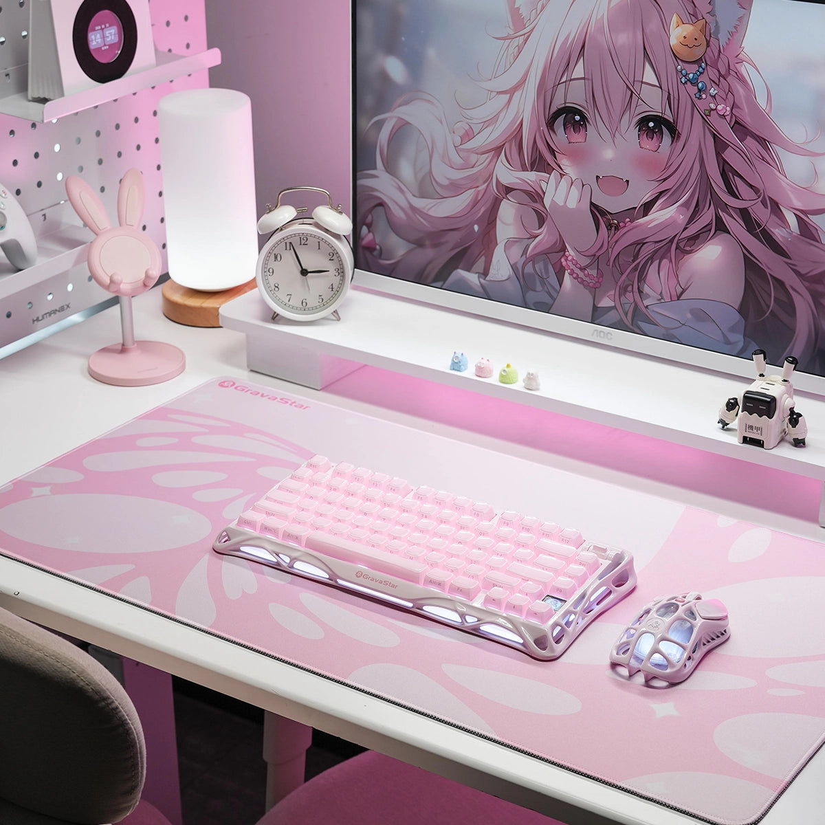 GravaStar Gaming Mouse Pad Pink extended cyberpunk deskmat studio setup view featuring waterproof micro-weave surface, fluid bubble grid pattern, Mercury V60 Crystal Rose keyboard, and Mercury M1 Pro Sakura Pink gaming mouse.