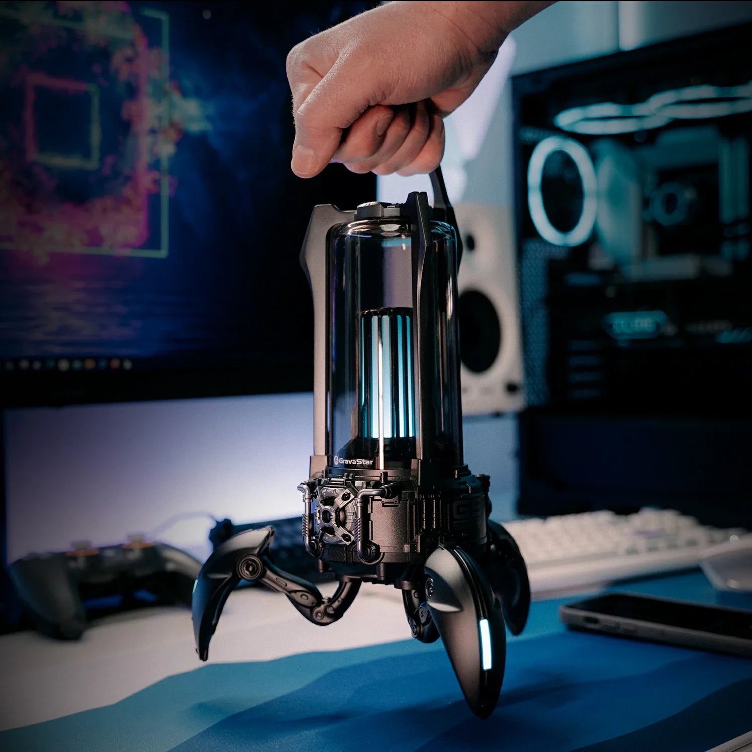 GravaStar Supernova Matt Black mecha lantern Bluetooth speaker featuring removable carry handle, lightweight 1.6kg design, 25W dual-driver sound system, 3-legged tripod stand, and ice blue RGB lighting.