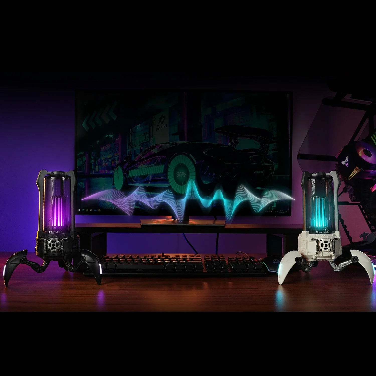 GravaStar Supernova Matt Black and Dawn White Bluetooth speakers demonstrating True Wireless Stereo pairing with Bluetooth 5.3, 25W dual-driver sound system per speaker, and customizable RGB lighting.