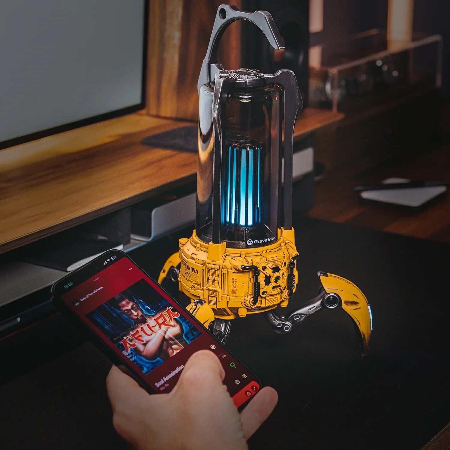 GravaStar Supernova War Damaged Yellow mecha lantern Bluetooth speaker demonstrating Bluetooth 5.3 wireless connectivity, smartphone music playback, 20m range, 25W dual-driver sound system, and vibrant RGB lighting.