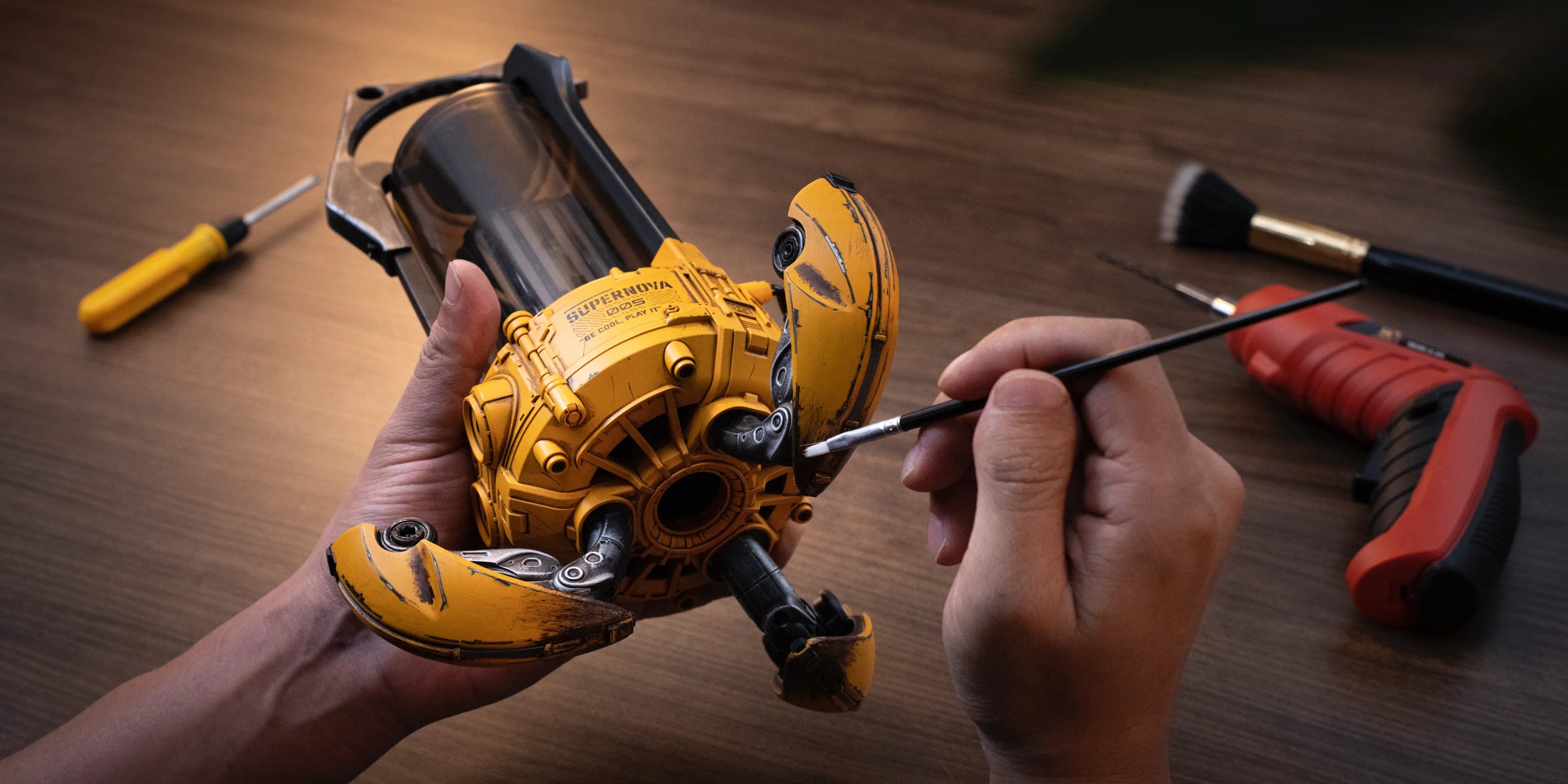 GravaStar Supernova War Damaged Yellow mecha lantern Bluetooth speaker close-up displaying handcrafted weathering process by artisan featuring zinc aluminium alloy frame, 25W sound system, and unique distressed finish.