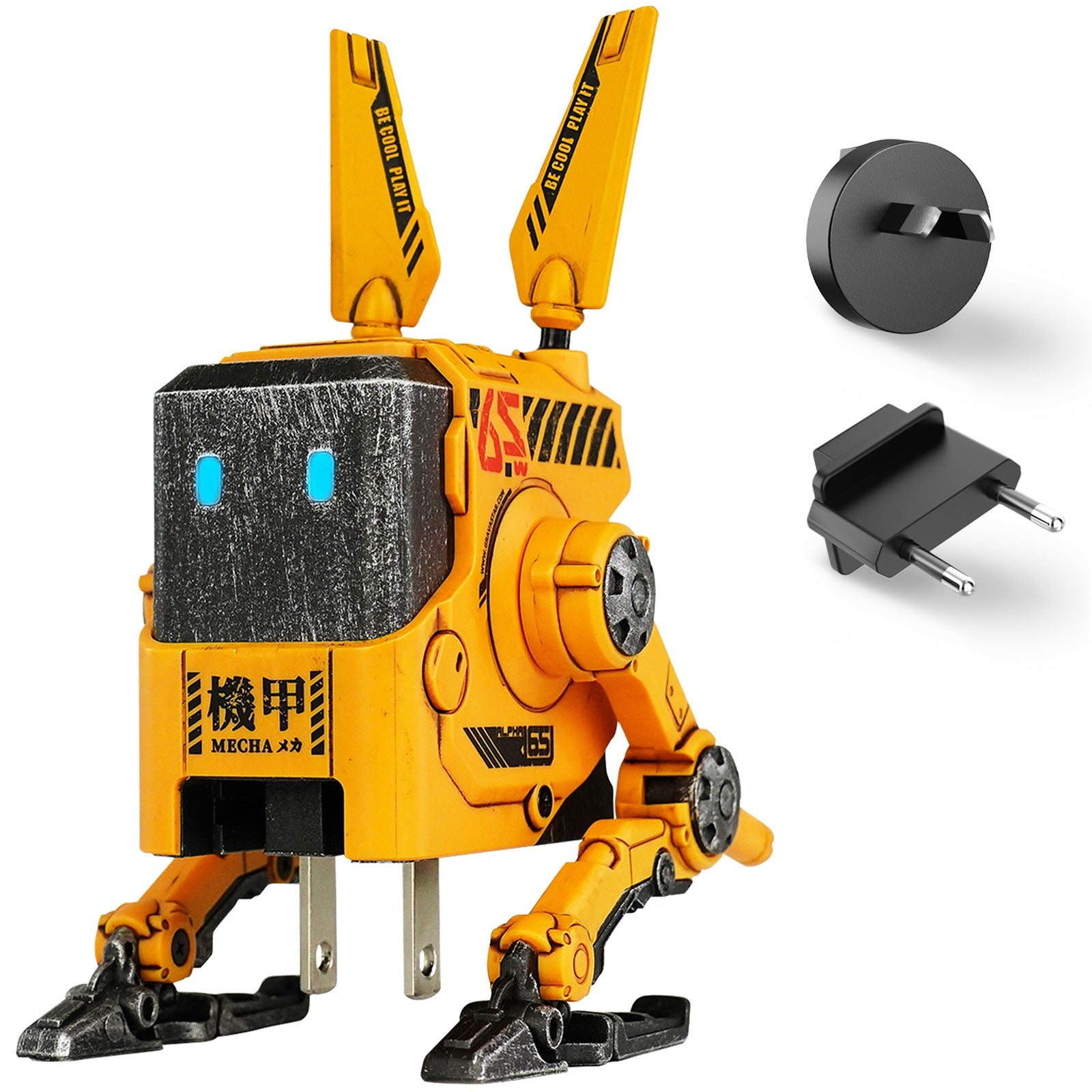 GravaStar Alpha65 War-Damaged Yellow handcrafted 65W GaN fast charger studio standing front view with UK and EU plug adapters featuring authentic weathered yellow finish, transformable tripod stand, dual antennas, ice blue RGB eyes, and 3 USB ports, perfect paired with Mercury X Pro Yellow mouse and Mercury K1 Pro Yellow keyboard.