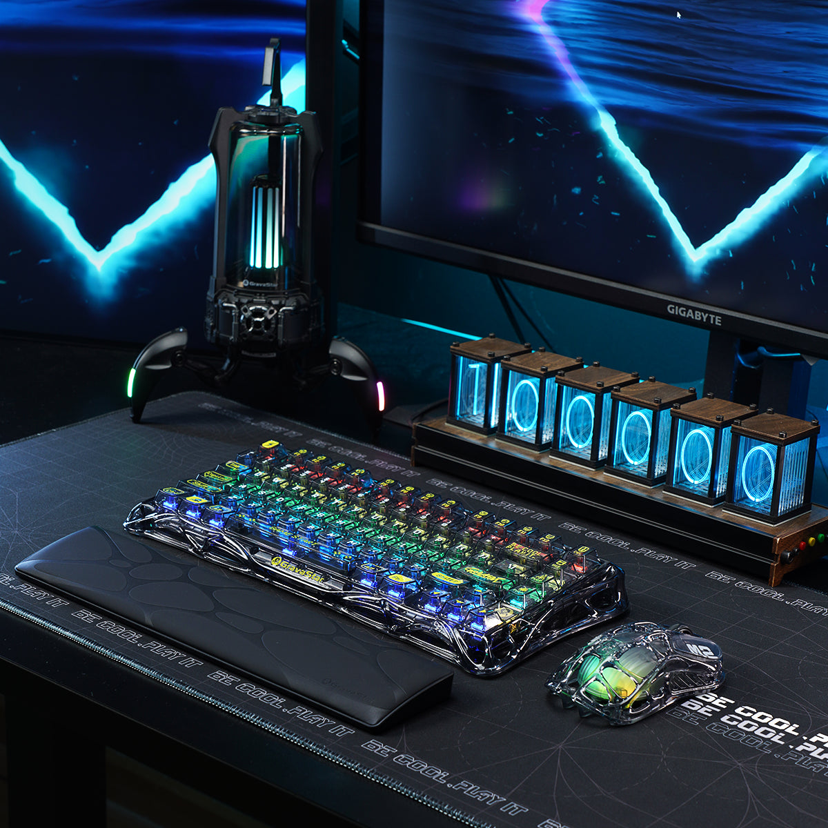 GravaStar Core Flex Gaming Set Transparent Black studio complete cyberstation desk setup scene view featuring Mercury K1 Lite 75% wireless mechanical keyboard with RGB backlighting, Mercury M2 gaming mouse with PAW3395 sensor, and free bonus keyboard wrist rest pad, perfect paired with GravaStar Gaming Mouse Pad black deskmat and Mars Pro Black speaker.