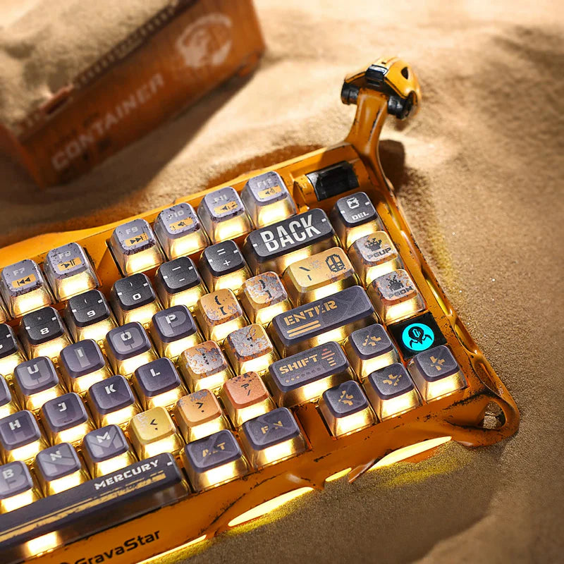 GravaStar Handcrafted Gaming Set Battle-Worn Yellow studio Mercury K1 Pro keyboard weathered chassis close-up view featuring handcrafted aluminum alloy frame, Kailh Speedy Mint linear switches, Pudding PBT keycaps, and warm RGB backlighting, perfect paired with Mercury X Pro 8KHz gaming mouse and GravaStar Gaming Mouse Pad black deskmat.