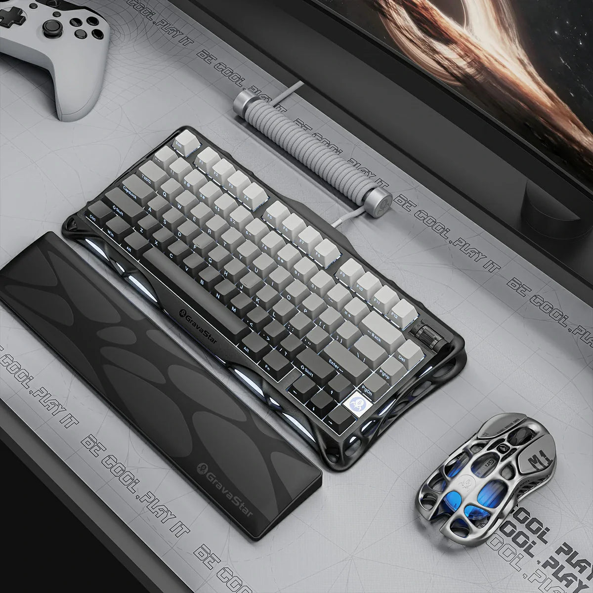 GravaStar Mercury K1 Gradient Black – Desk setup featuring 75% wireless mechanical gaming keyboard with wrist rest, M1 Pro mouse, coiled aviator cable, aluminum alloy gradient frame, and blue RGB backlight.