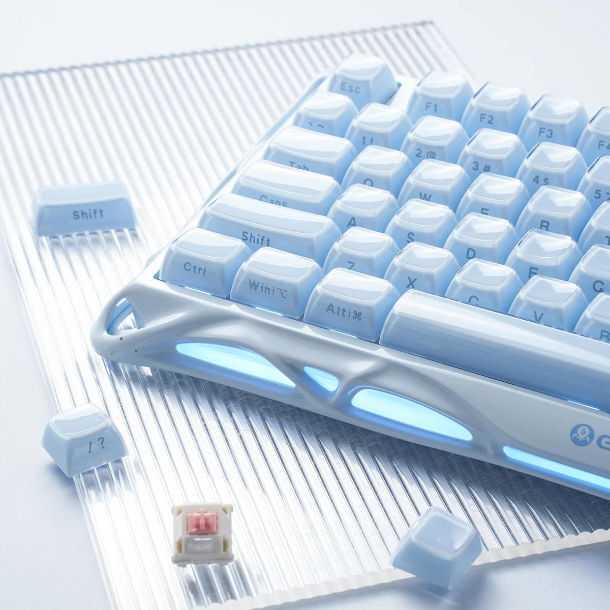 GravaStar Mercury K1 Ice Blue Edition 75% mechanical gaming keyboard close-up – Demonstrating hot-swappable PCB, GravaStar Custom Linear Switches, switch puller tool, and translucent PBT keycap removal.
