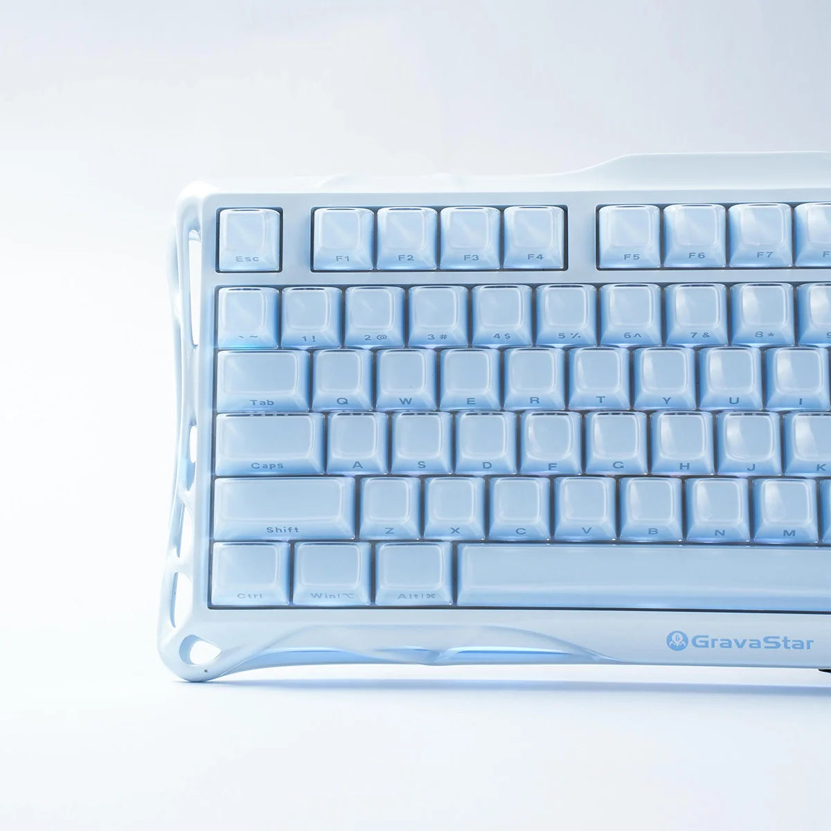 GravaStar Mercury K1 Ice Blue Edition 75% mechanical gaming keyboard close-up – Showcasing translucent white and ice-blue keycaps, matte aluminum alloy chassis frame, and custom linear switches.