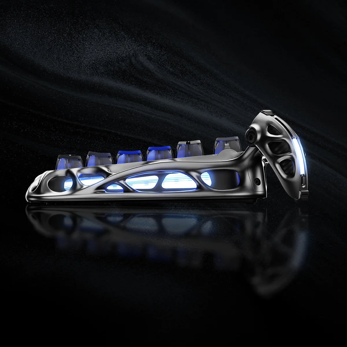 GravaStar Ultimate Gaming Set in Interstellar Silver – Close-up side view of Mercury K1 Pro 75% wireless mechanical gaming keyboard showing nano-textured aluminum alloy exoskeleton chassis, icy blue RGB lighting, and gasket-mounted FR4 plate.