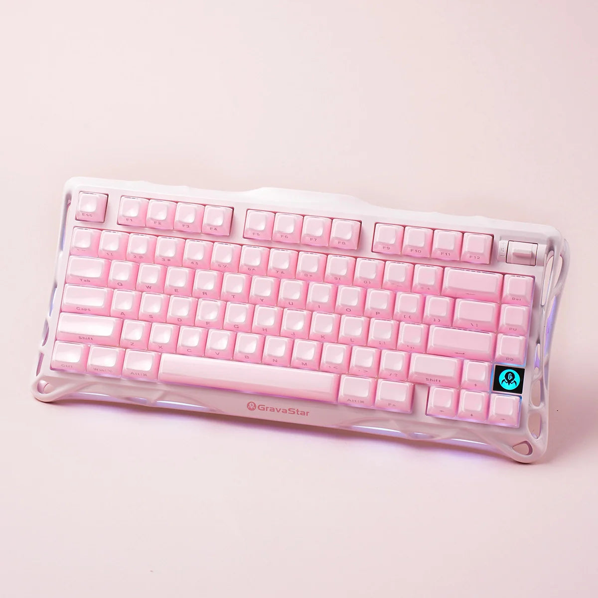 GravaStar Mercury K1 Special Edition Sakura Pink – Top-angle view of 75% wireless mechanical gaming keyboard with aluminum alloy exoskeleton frame, hot-swap linear switches, Gasket mount, and soft customizable RGB lighting.