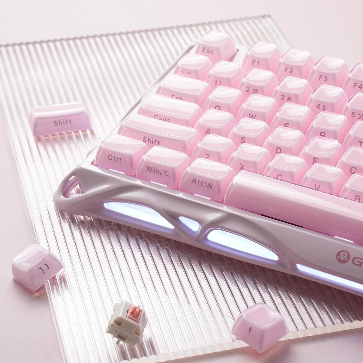 GravaStar Mercury K1 Special Edition Sakura Pink – Close-up of 75% mechanical gaming keyboard showing aluminum alloy exoskeleton frame, hot-swap custom linear switches, PBT keycaps, and Gasket mount structure.