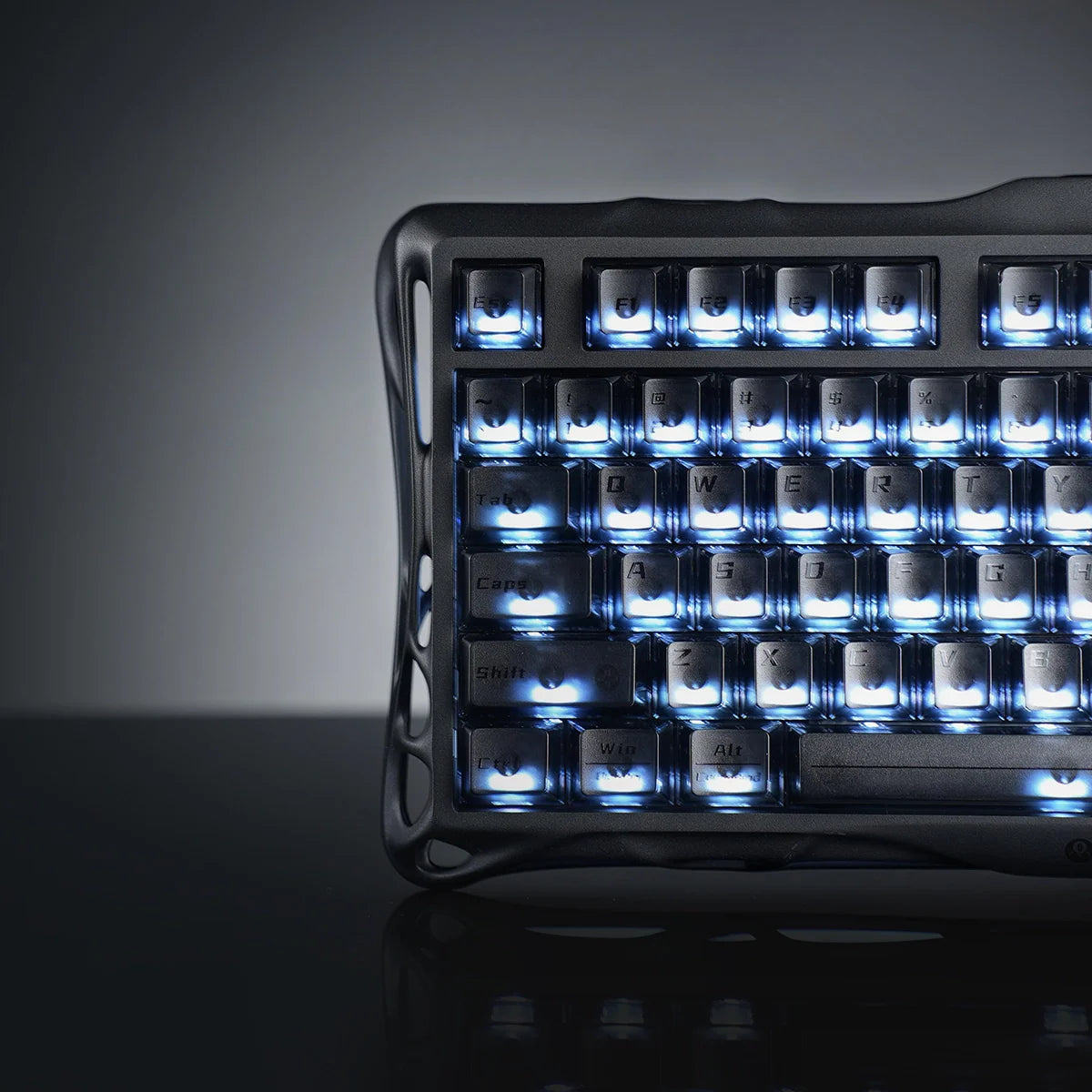 GravaStar Mercury K1 Stealth Black 75% mechanical gaming keyboard macro view – Highlighting matte black aluminum frame, translucent PBT keycaps, custom Stellar Bloom linear switches, and dual RGB backlighting.