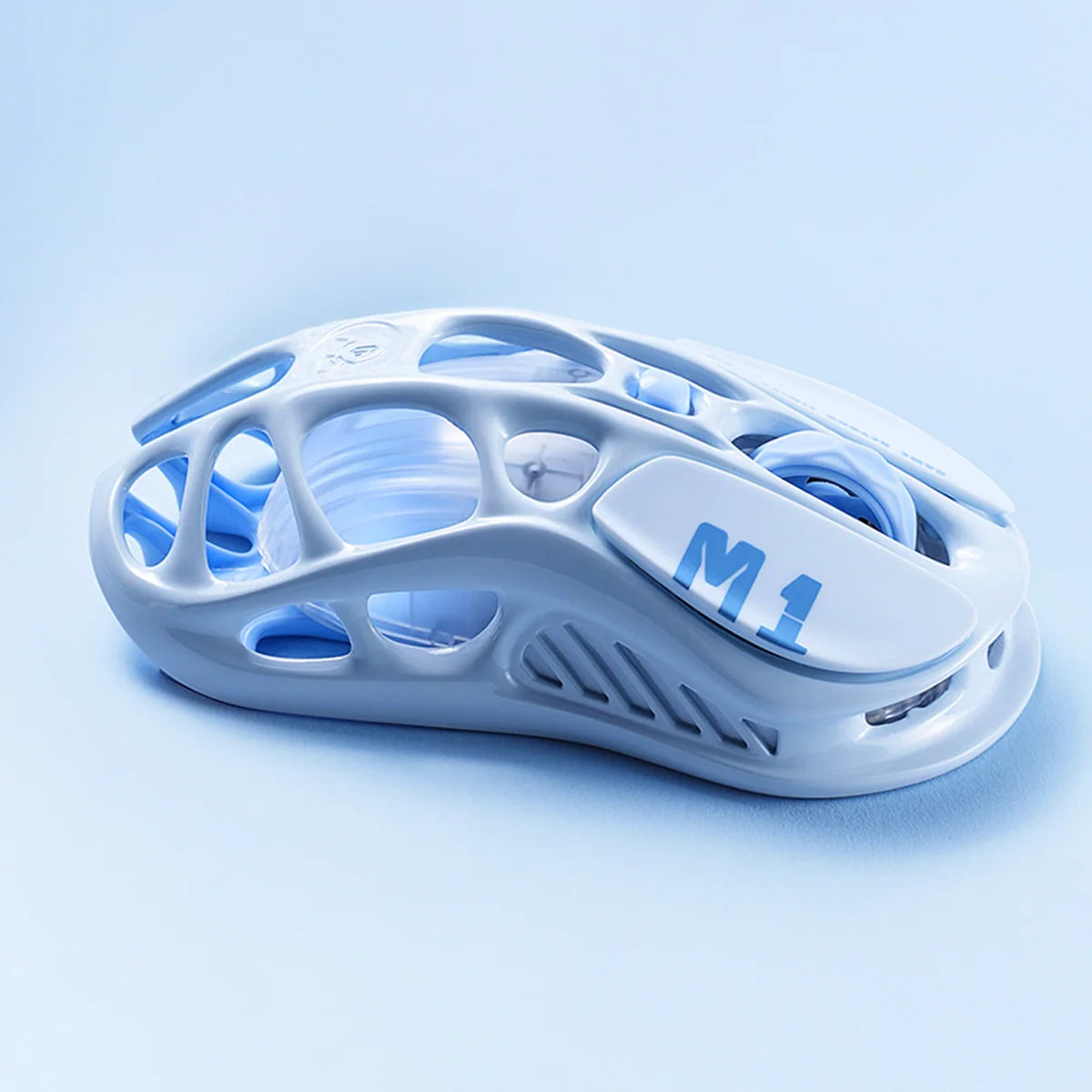 GravaStar Mercury M1 Pro Special Edition Ice Blue wireless gaming mouse right side profile view featuring 88g magnesium alloy skeletal frame, PAW3395 26K DPI sensor, 4KHz polling rate support, and ice blue RGB lighting, perfect paired with Mercury K1 Ice Blue keyboard and Supernova White speaker.