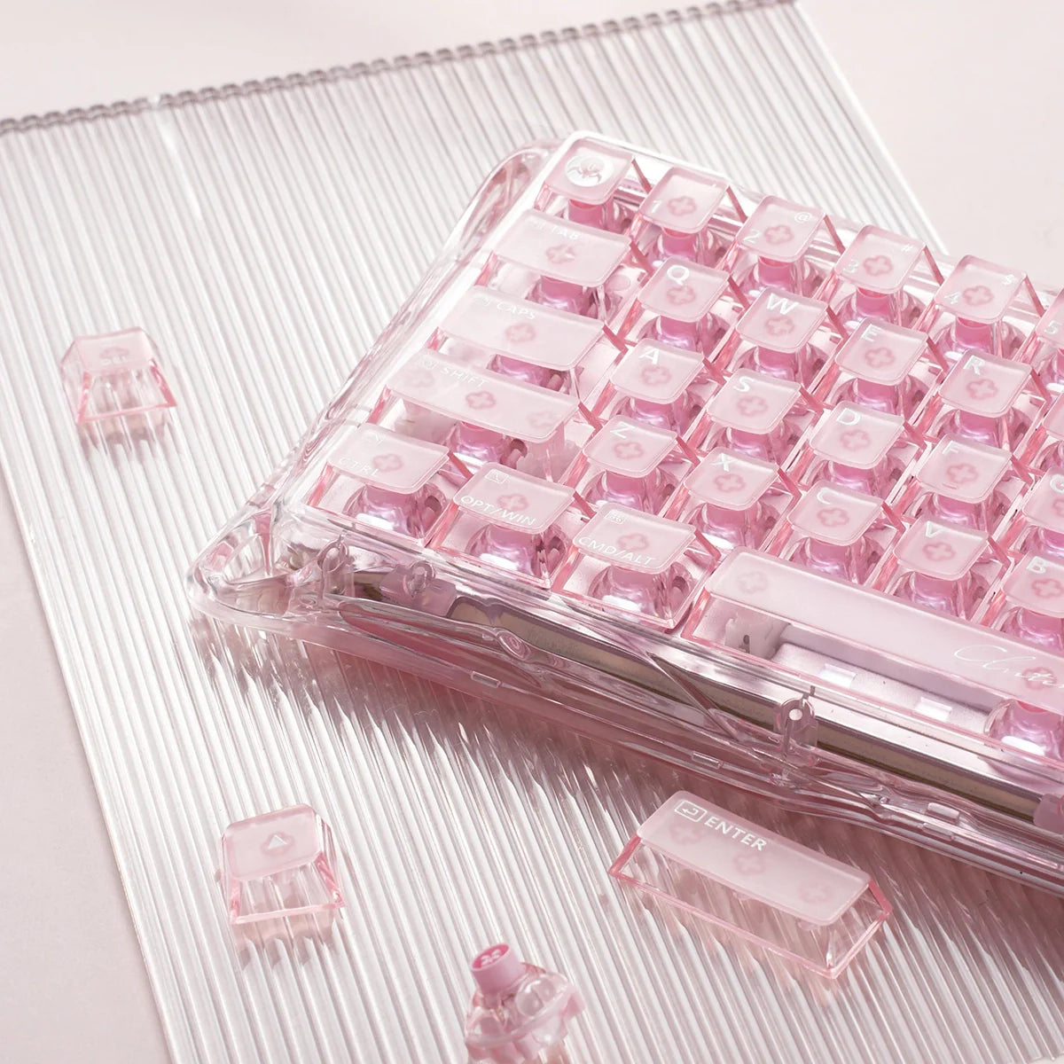 GravaStar Mercury V60 Crystal Rose 60% magnetic gaming keyboard featuring WASD key area, loose UFO Hall Effect switch, full-transparent rose crystal chassis, and True 8kHz performance, perfect paired with Mercury M2 Crystal Rose mouse and Mars Pro speaker.