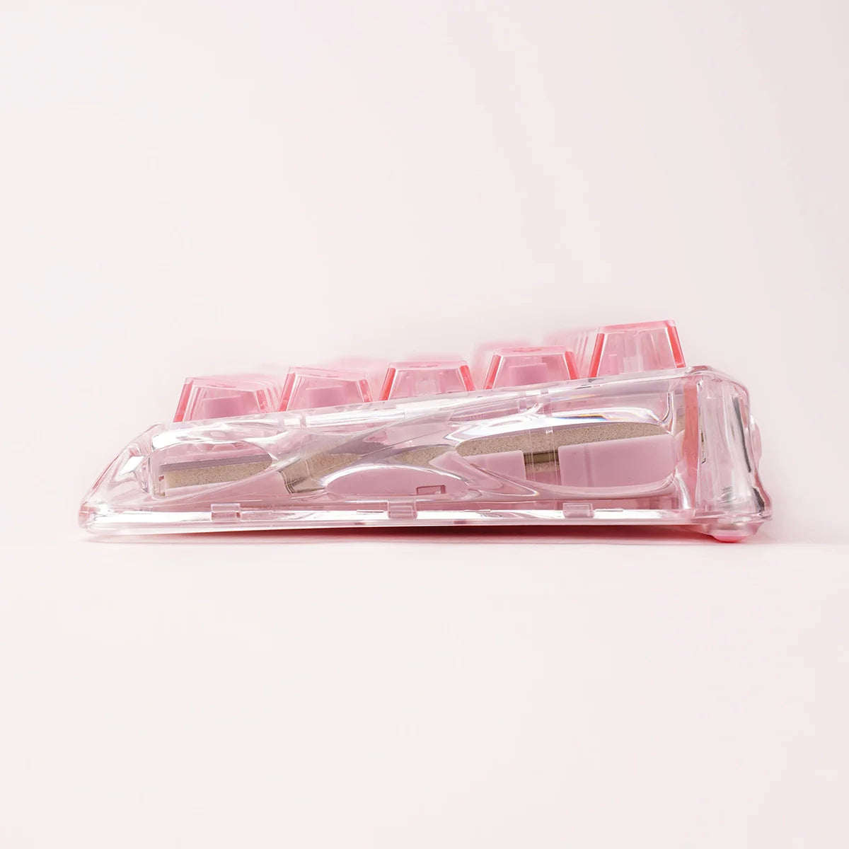 GravaStar Mercury V60 Crystal Rose 60% magnetic gaming keyboard side profile view – Highlighting full-transparent rose crystal chassis, 4-layer acoustic foam, True 8kHz performance, and UFO Hall Effect switches, perfect paired with Mercury M2 Crystal Rose mouse and Mars Pro speaker.