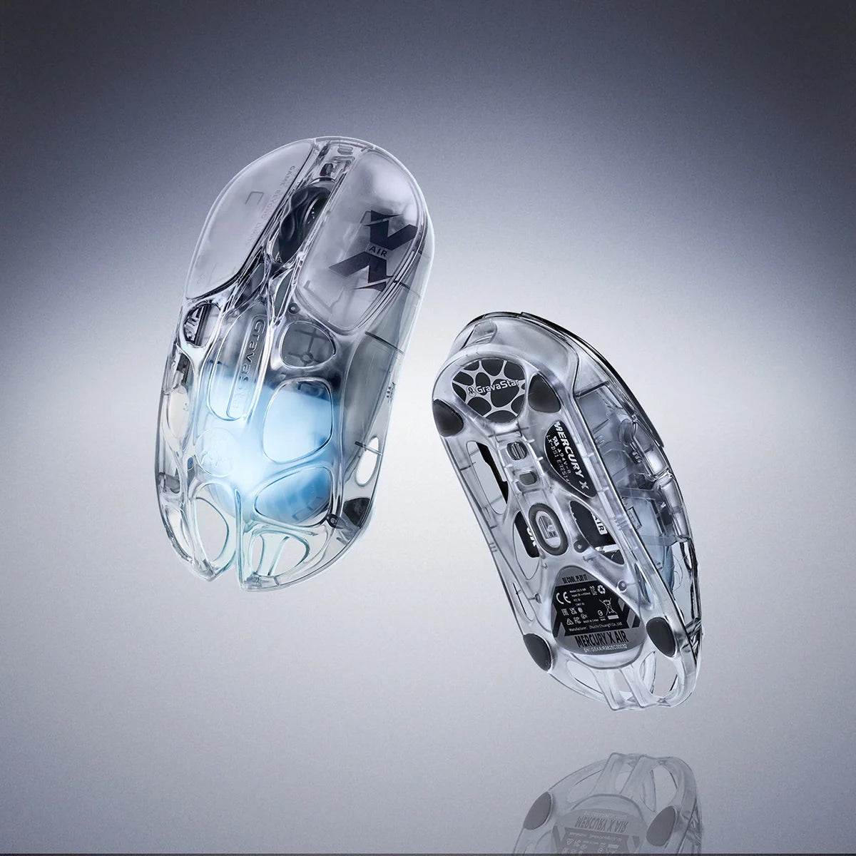GravaStar Mercury X Air 8KHz Onyx Crystal transparent wireless gaming mouse duo front and bottom view featuring 56g ultralight open-frame skeletal structure, PixArt PAW 3950 32K DPI sensor, tri-mode toggle switch, white Teflon feet pads, 8000Hz polling rate support, and ice blue RGB lighting, perfect paired with Mercury V60 Onyx Crystal keyboard and Mars Pro speaker.