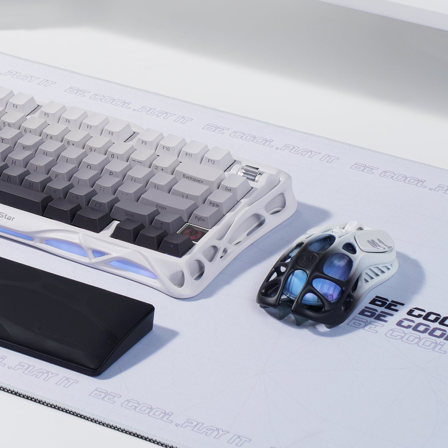 GravaStar Pro Gaming Set Gradient White studio desk setup perspective view featuring Mercury K1 keyboard with gradient white skeletal frame, Mercury M1 Pro 4K magnesium alloy gaming mouse, and GravaStar Keyboard Wrist Rest Pad, perfect paired with GravaStar Gaming Mouse Pad white deskmat and Supernova White speaker.