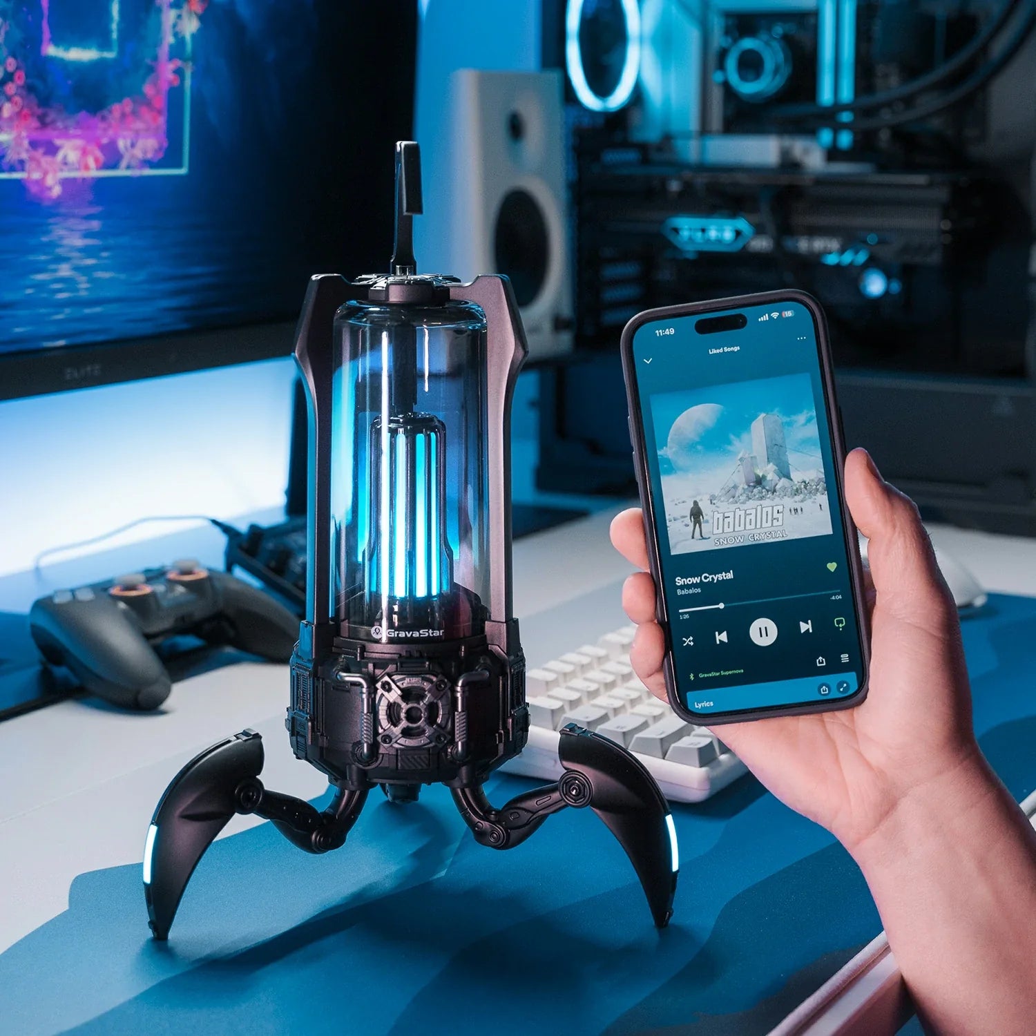 GravaStar Supernova Matt Black mecha-lantern Bluetooth speaker wireless control setup view featuring 25W dual-driver sound system, 3" woofer, 0.5" tweeter, zinc alloy frame, foldable tripod stand, carry handle, Bluetooth 5.3, and vibrant RGB lighting, perfect paired with Mercury X Air Onyx Crystal mouse and Mercury V60 keyboard.