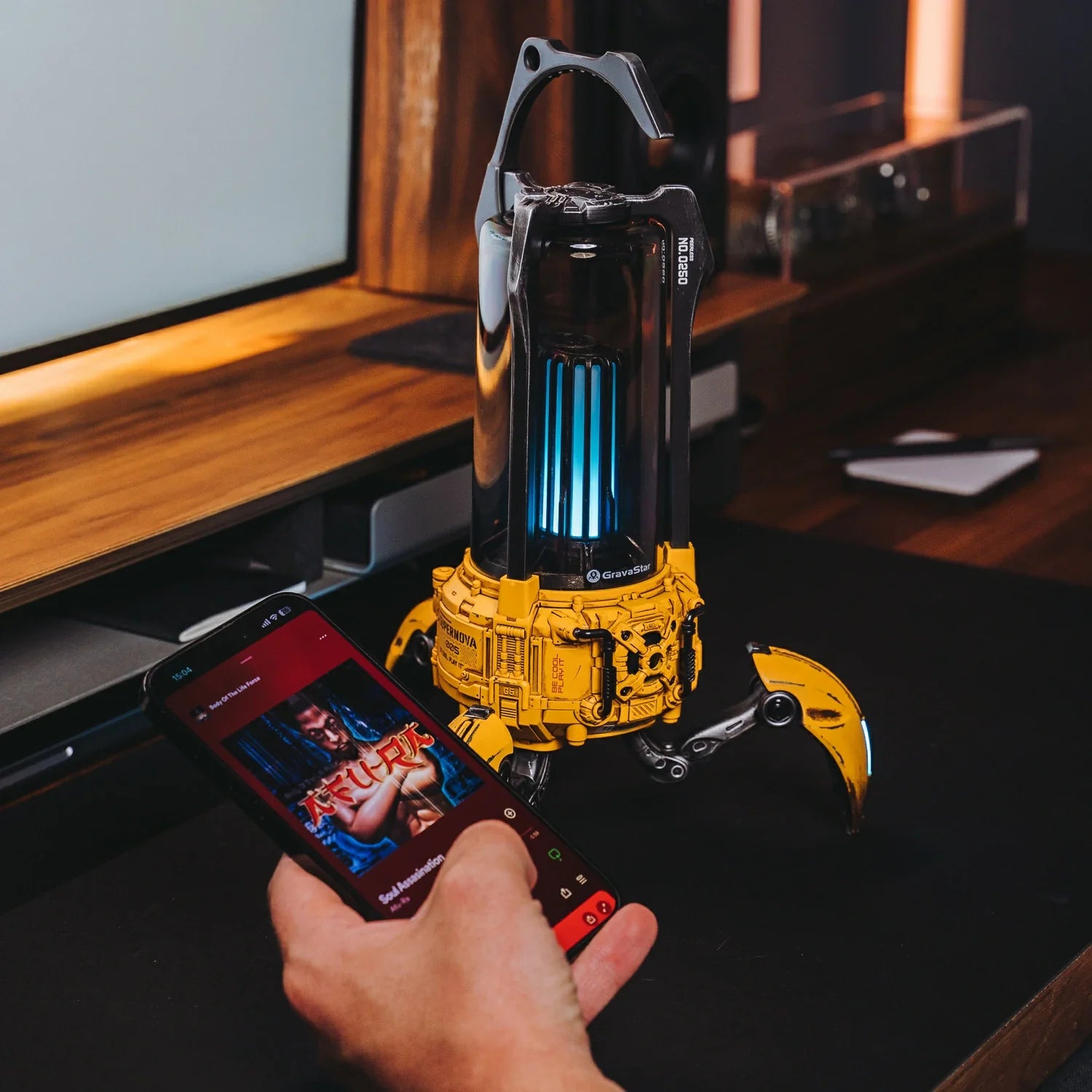 GravaStar Supernova War Damaged Yellow handcrafted mecha-lantern Bluetooth speaker wireless control setup view featuring 25W dual-driver sound system, 3" woofer, 0.5" tweeter, zinc alloy frame, foldable tripod stand, carry handle, Bluetooth 5.3, and vibrant RGB lighting, perfect paired with Mercury X Pro Yellow mouse and Mercury K1 Pro Yellow keyboard.